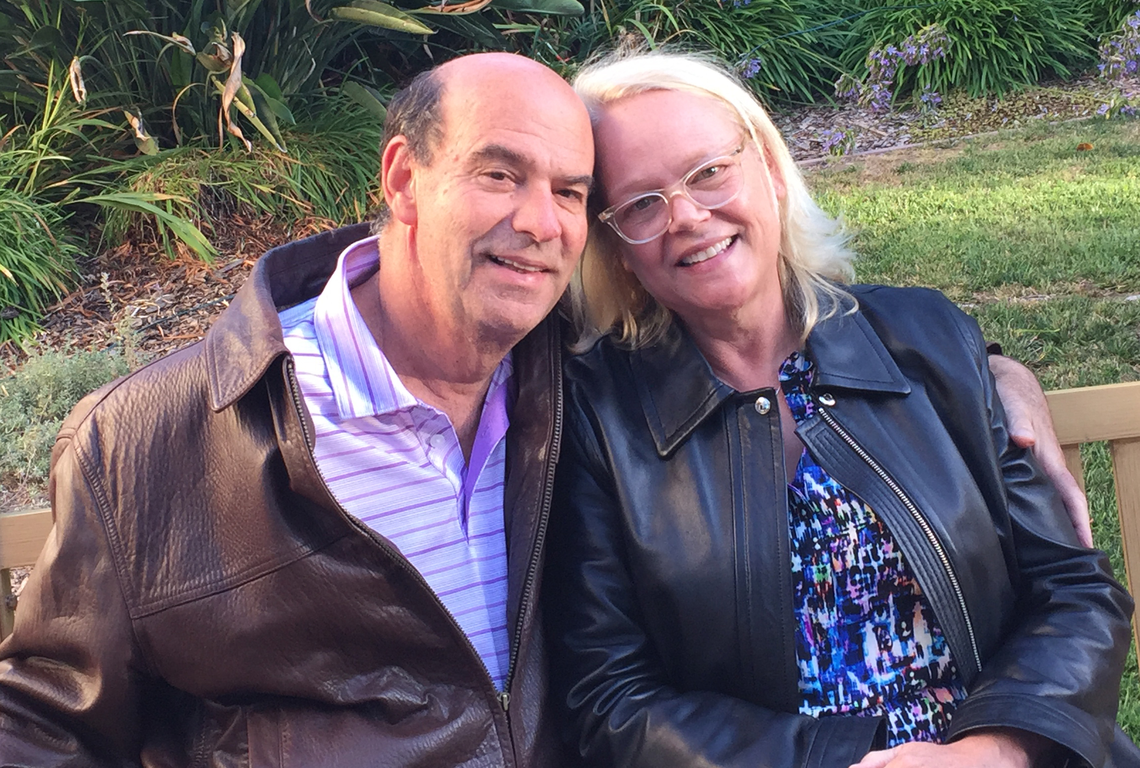 Jeff Greenwald with his wife, Susan — they're sitting on a bench together, smiling
