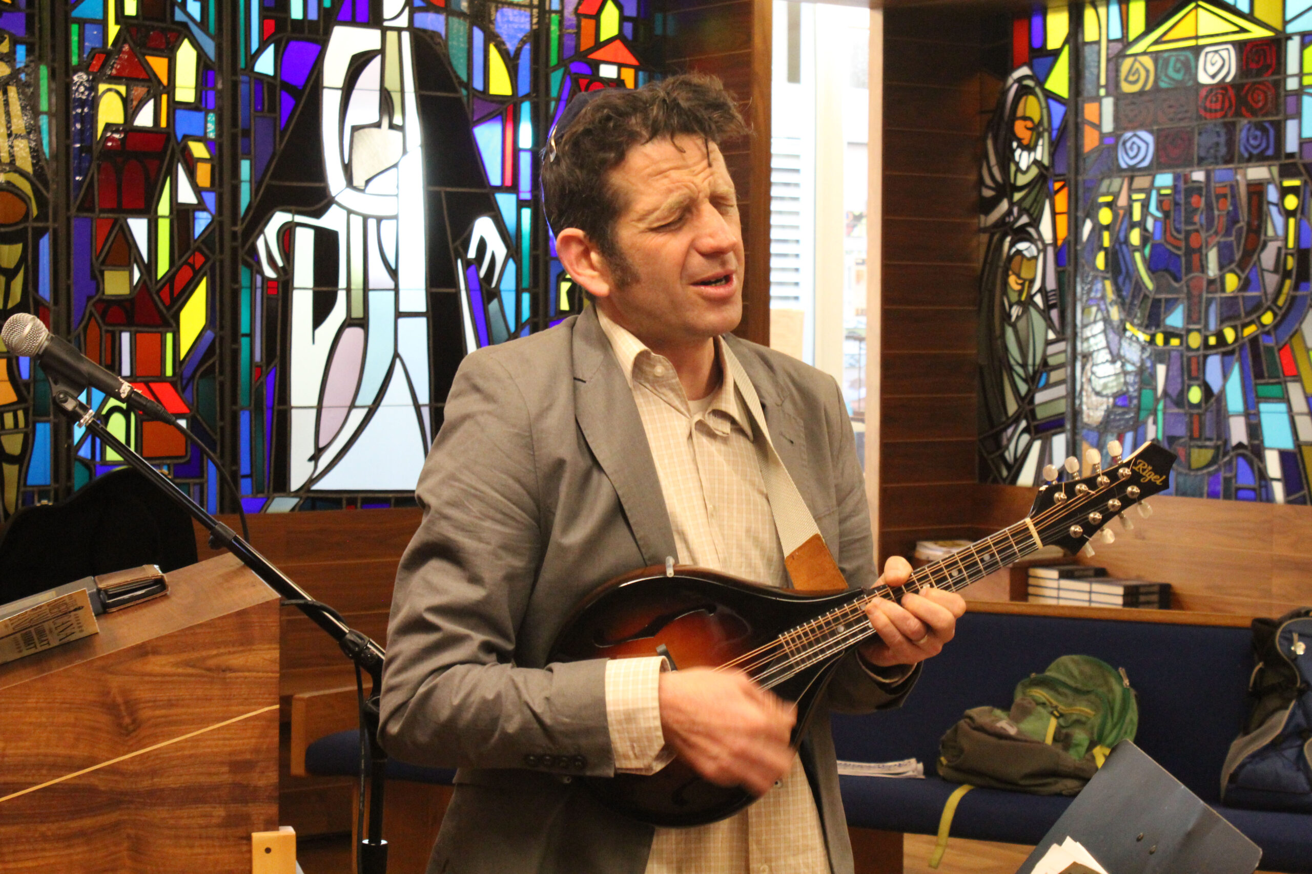 Bayer singing and playing mandolin