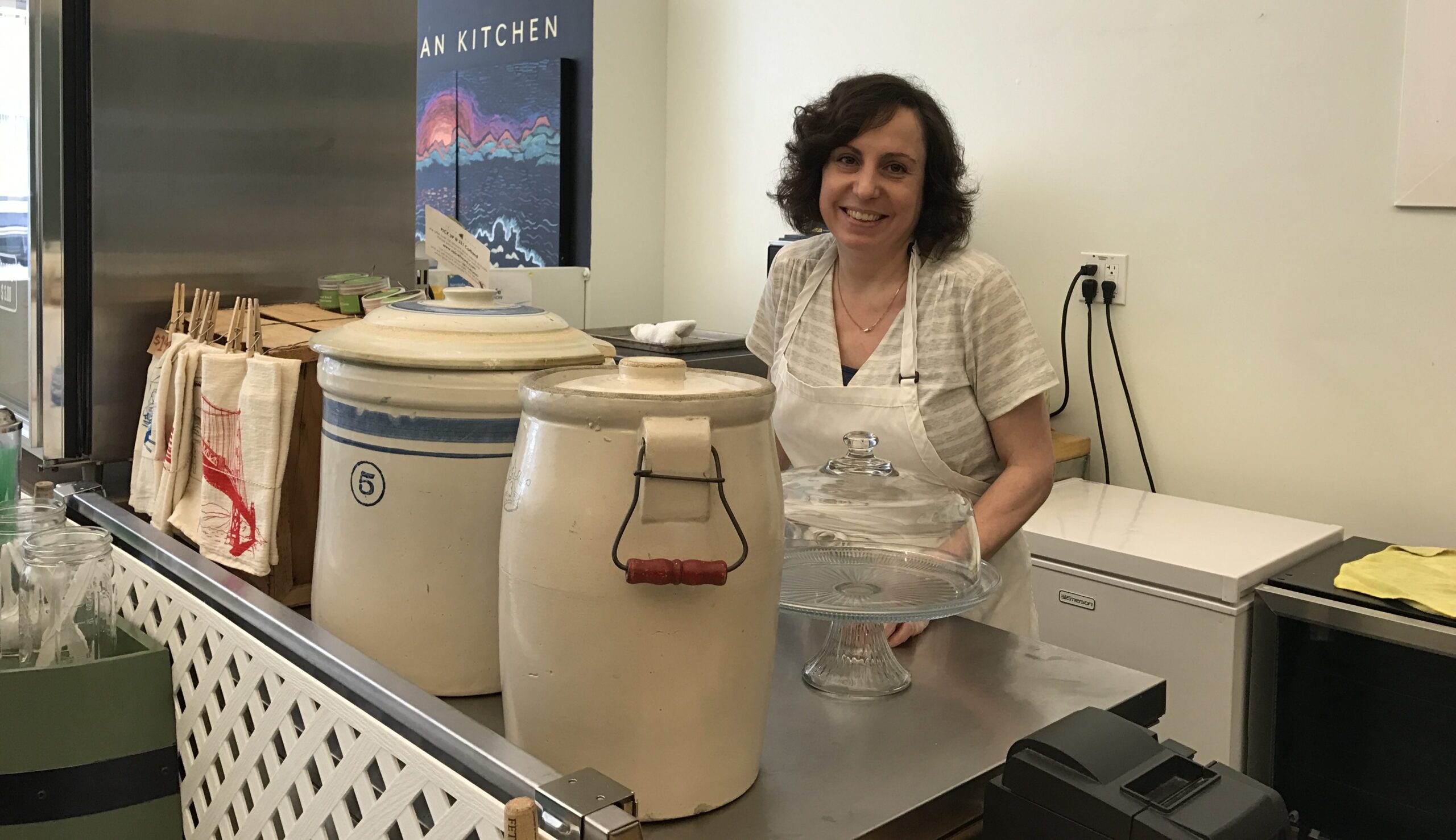 Ashby behind the counter at Paulie's Pickling