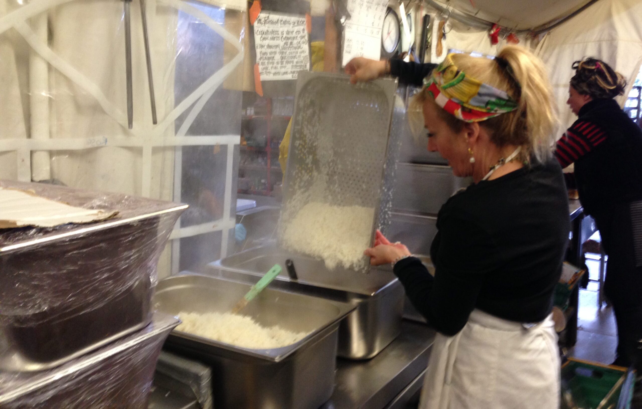 ets-hokin pours out a large tray of rice
