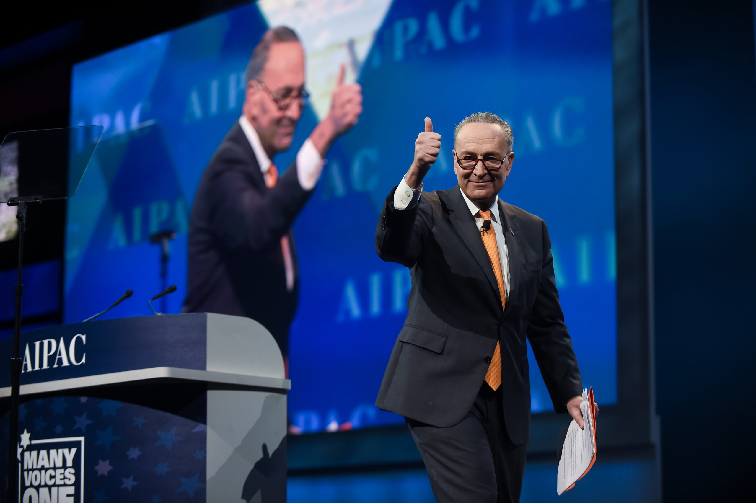 Schumer gives a thumbs up as he departs the stage