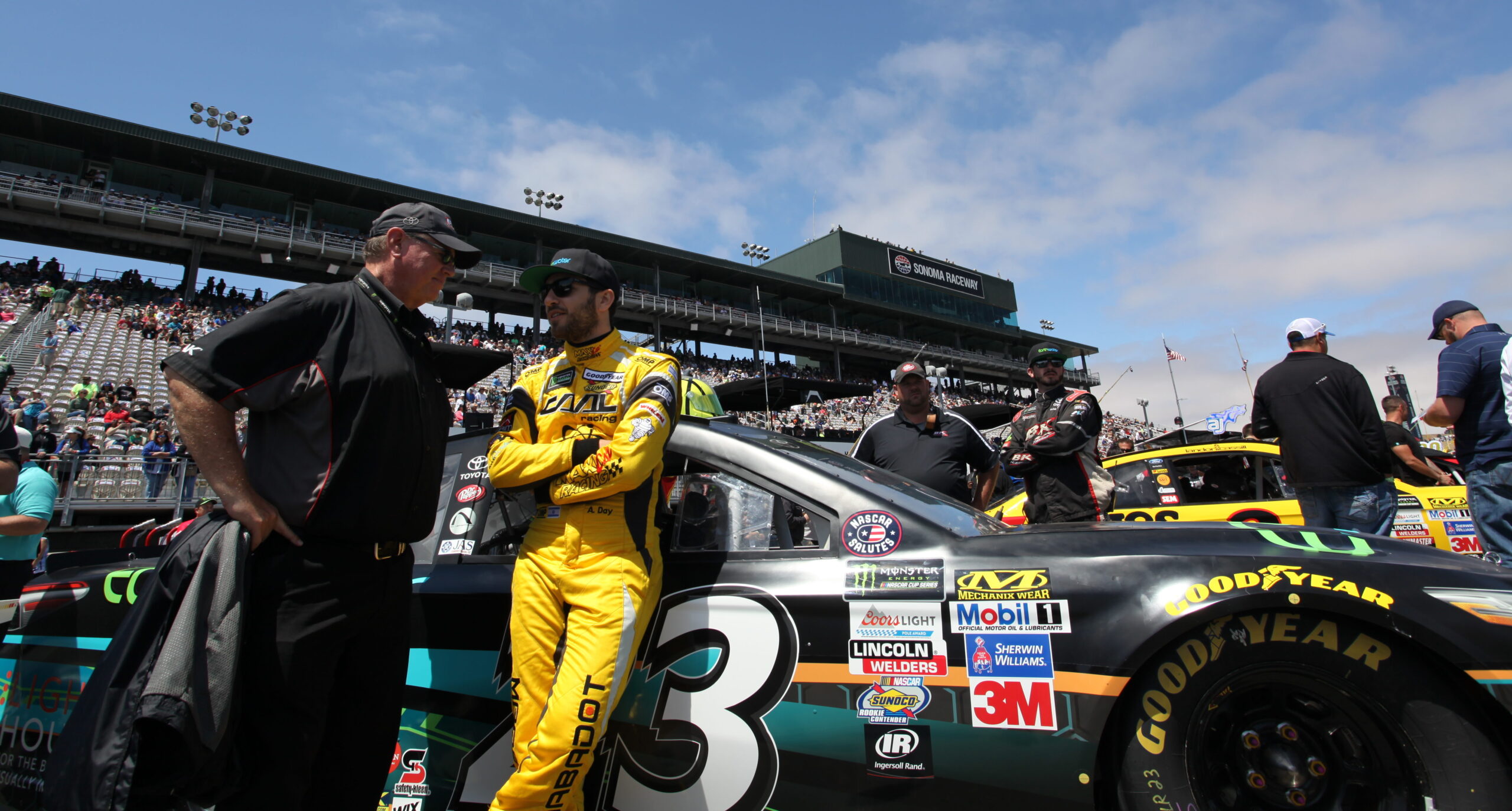 Israeli NASCAR driver Alon Day with his car at the Sonoma Raceway, June 25, 2017 (Photo/Max A. Cherney)