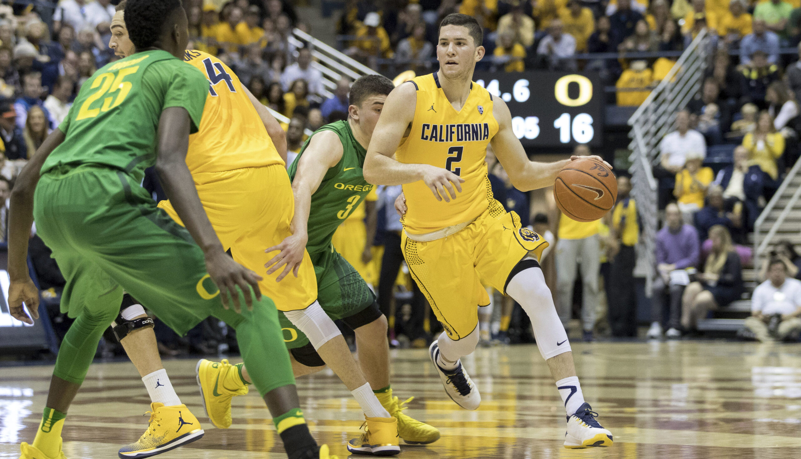 Singer dribbling past Oregon players