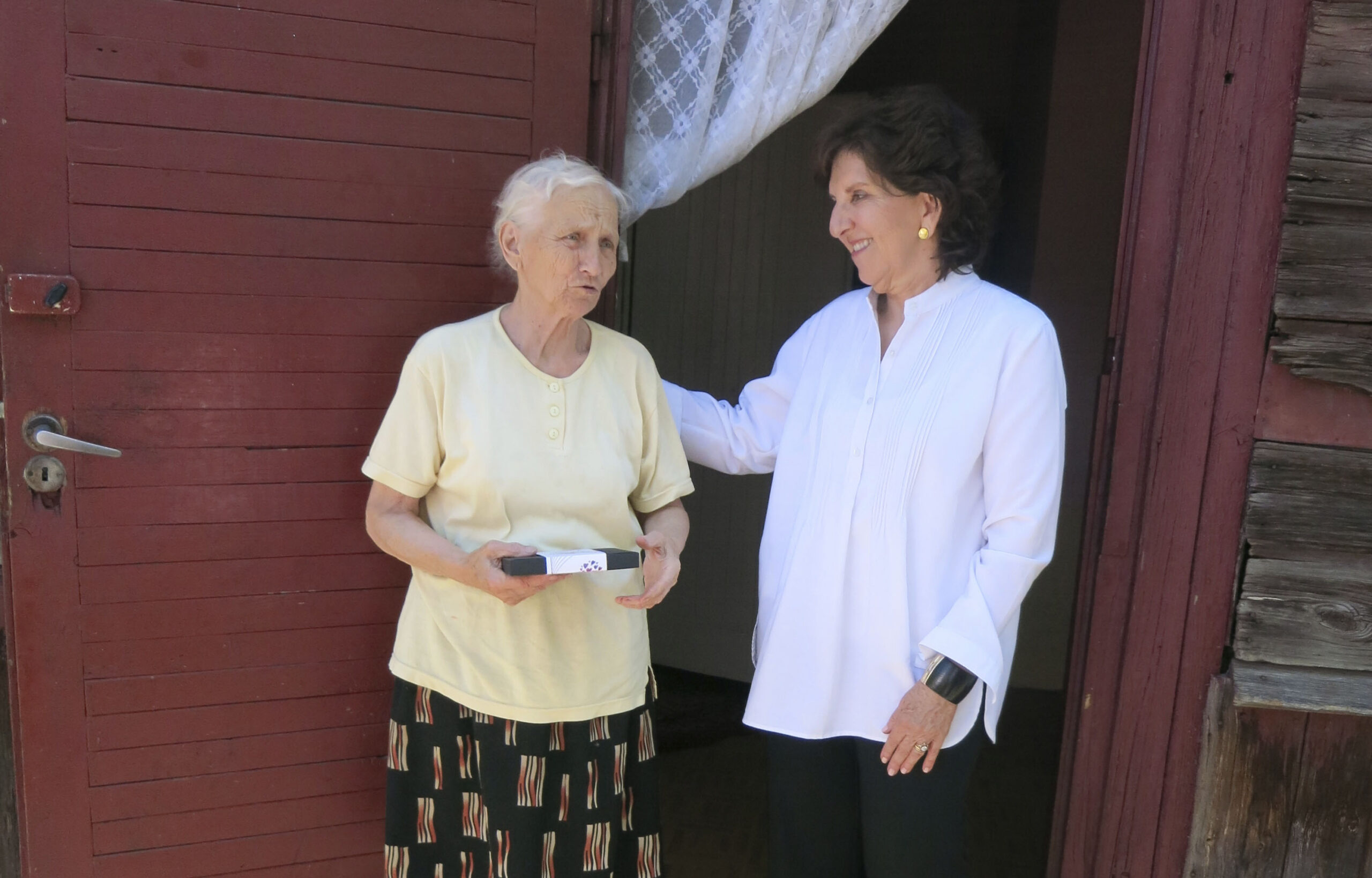 Polish Jews - Anita Friedman stands in a doorway with an much older woman
