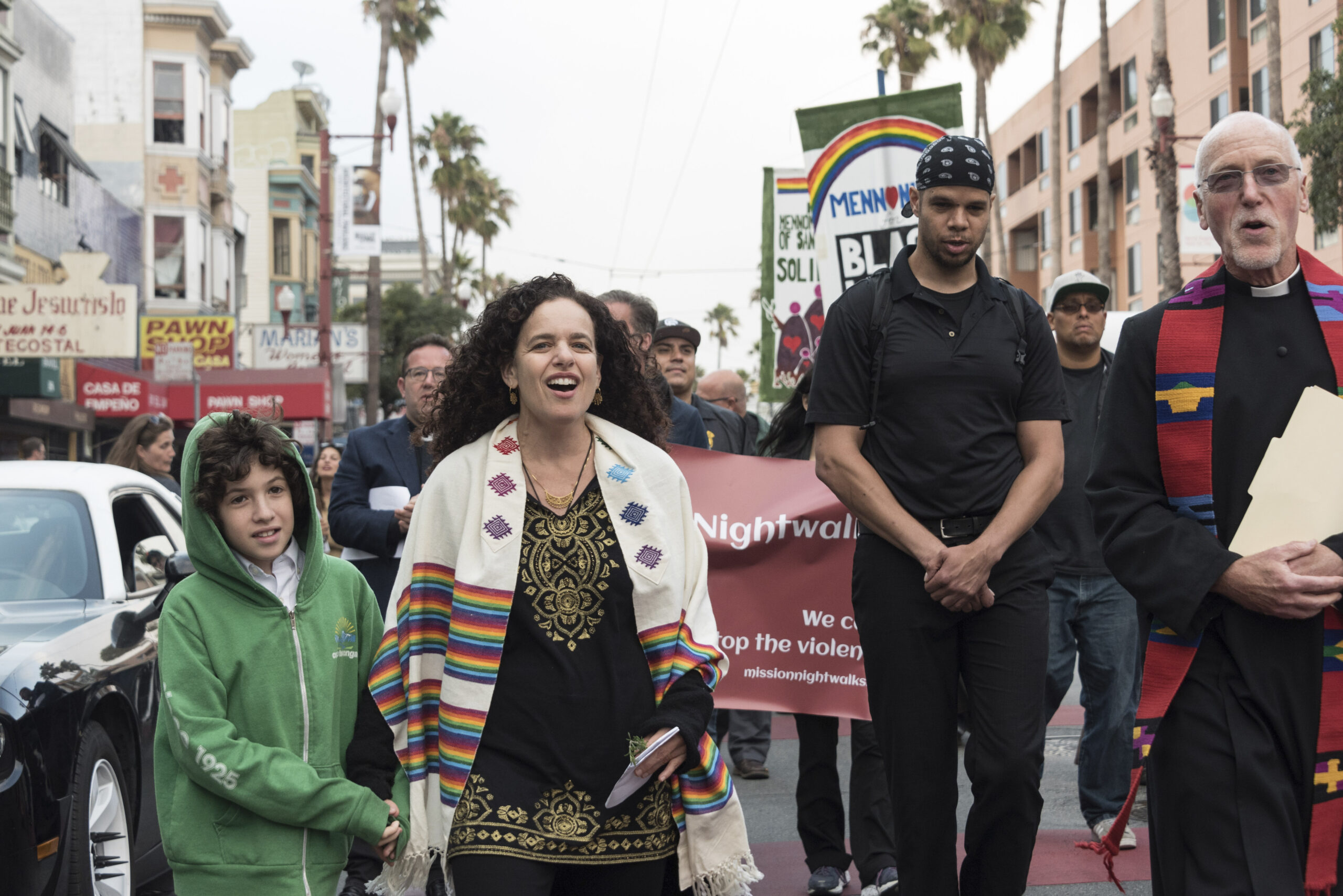 Rabbi Mychal Copeland and son Jonah take part in an Aug. 18 vigil against racism in the Mission District with the Rev. Richard Smith of the Episcopal Church of St. John the Evangelist (right) and other faith leaders. (Photo/Norm Levin)