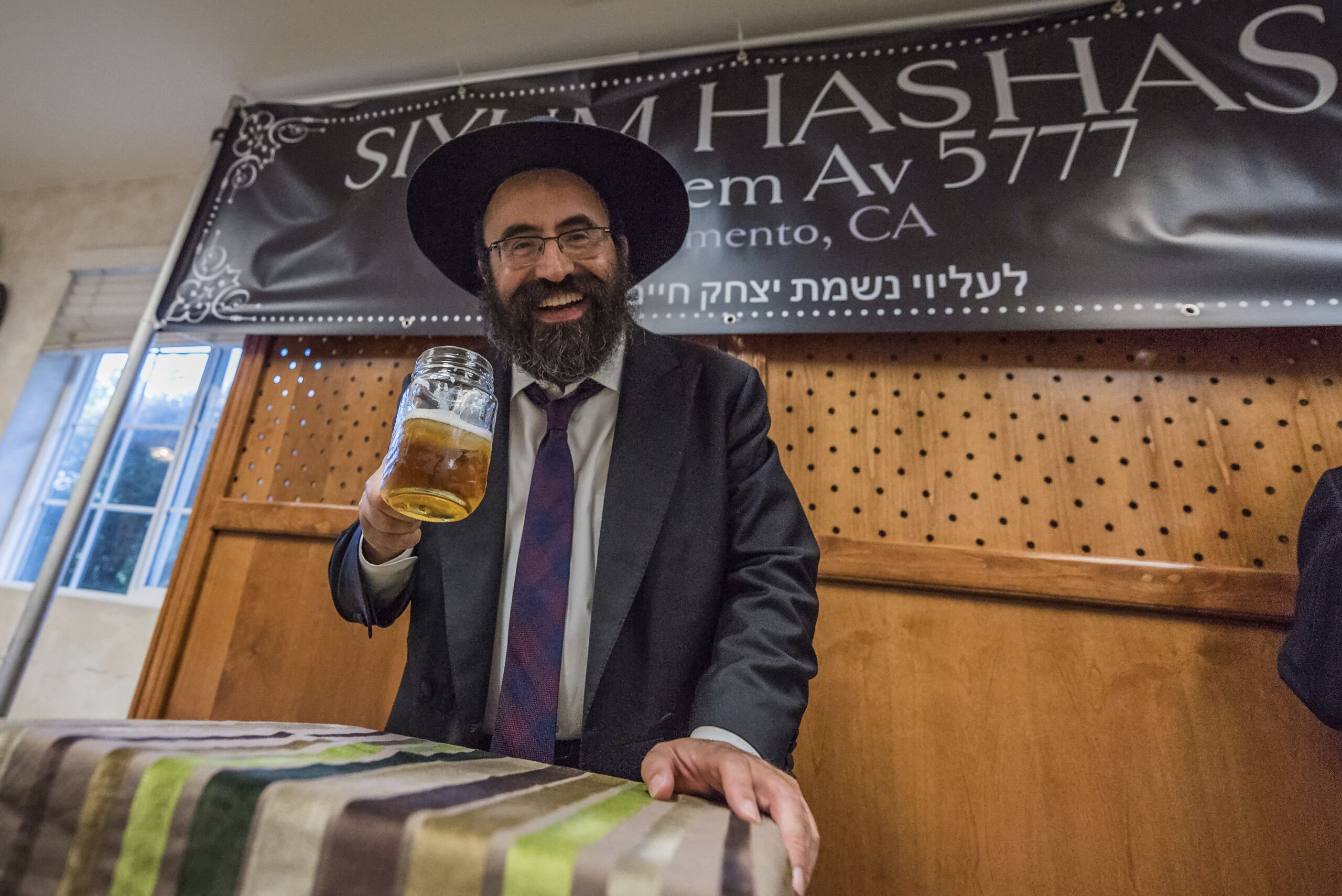 Chabad of Sacramento Rabbi Mendy Cohen celebrates the completion of 7 years of Talmud study, July 27, 2017. (Photo/Steven Styles-Belator Media)