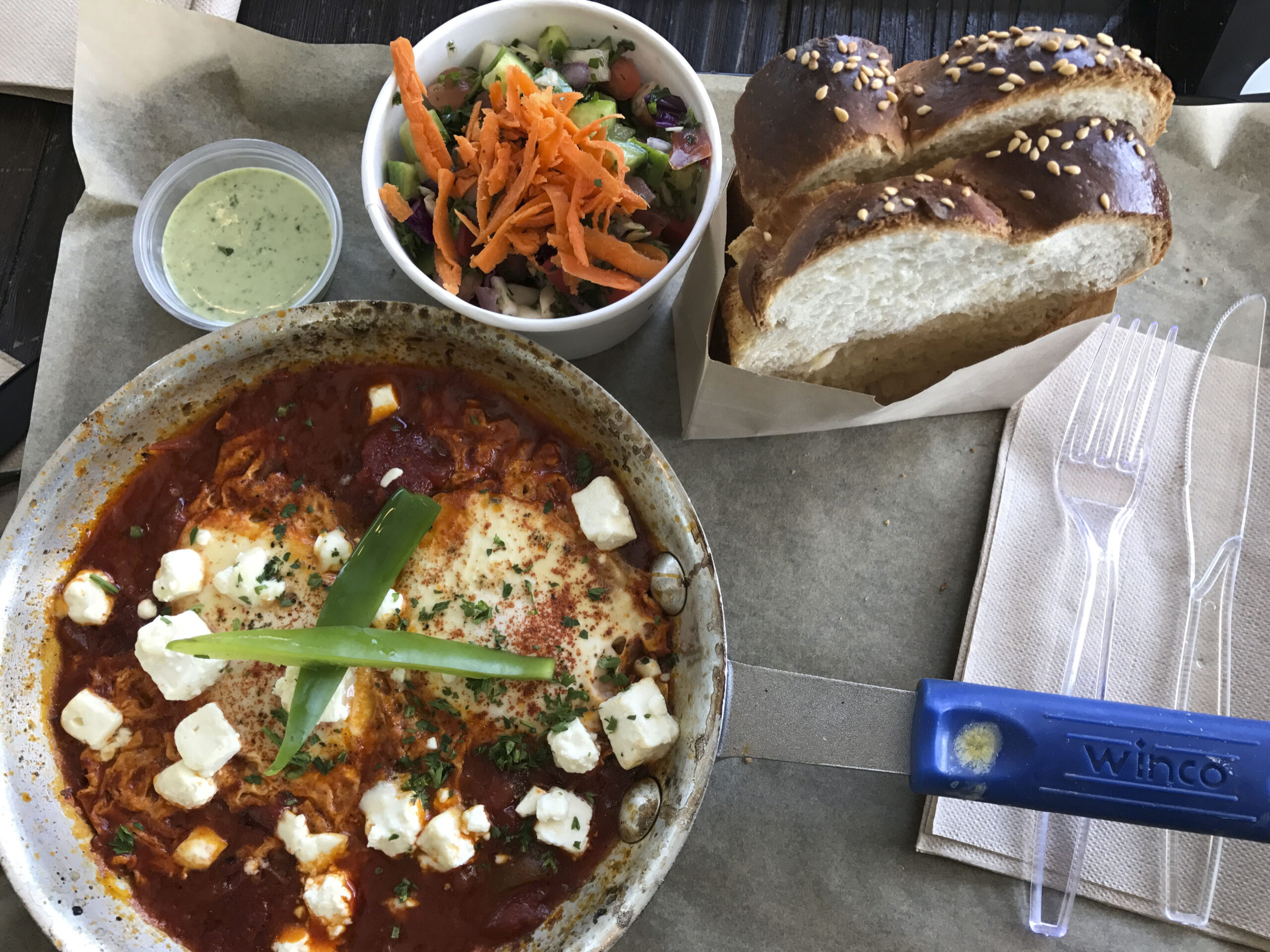 The challah at Café Stop makes an excellent sponge to soak up sauce from the shakshouka. (Photo/Alix Wall)