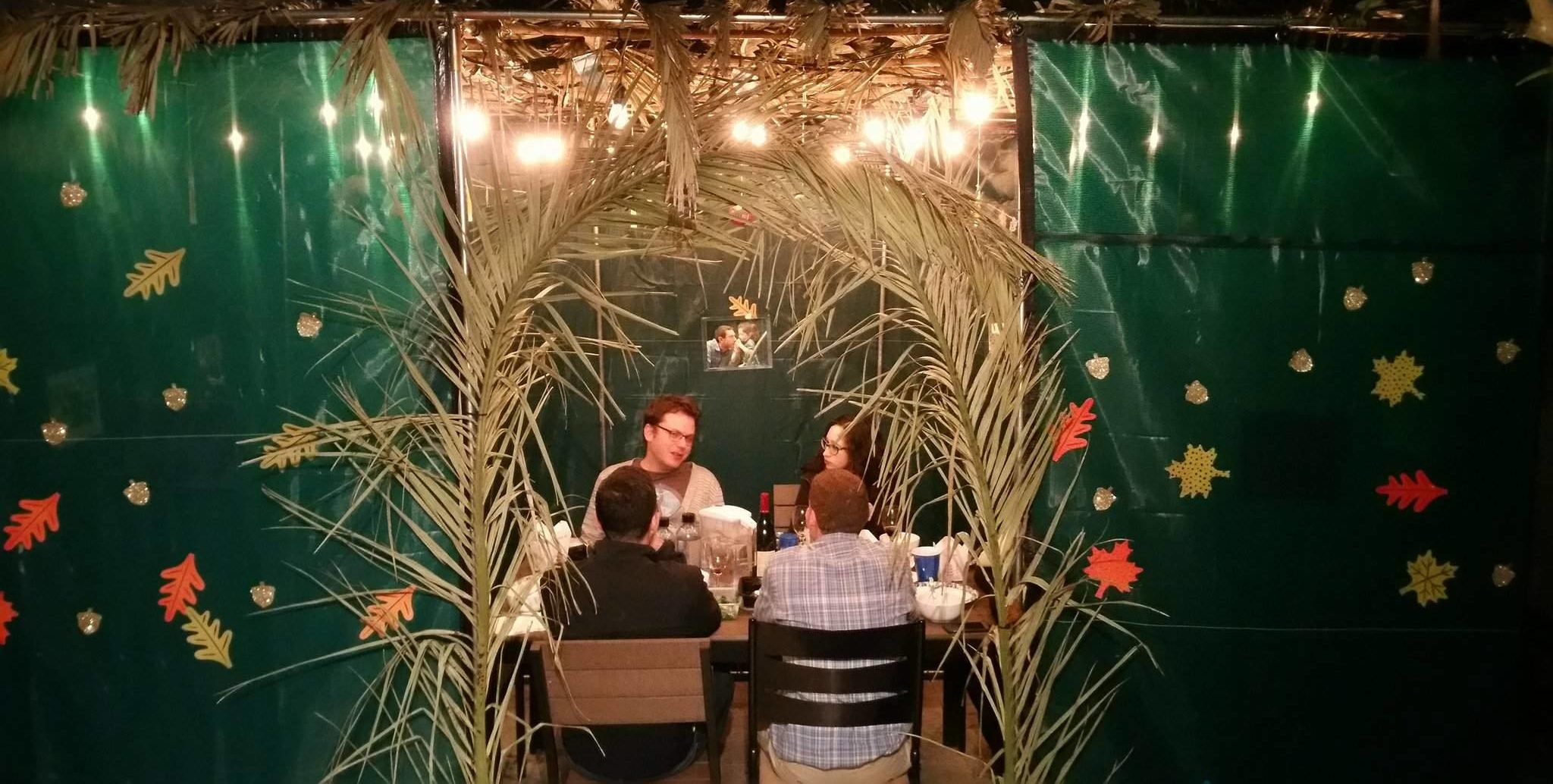 Dinner in Cantor David Frommer’s sukkah in his San Francsico home, Oct. 10, 2017. (David A.M. Wilensky/J. Staff)