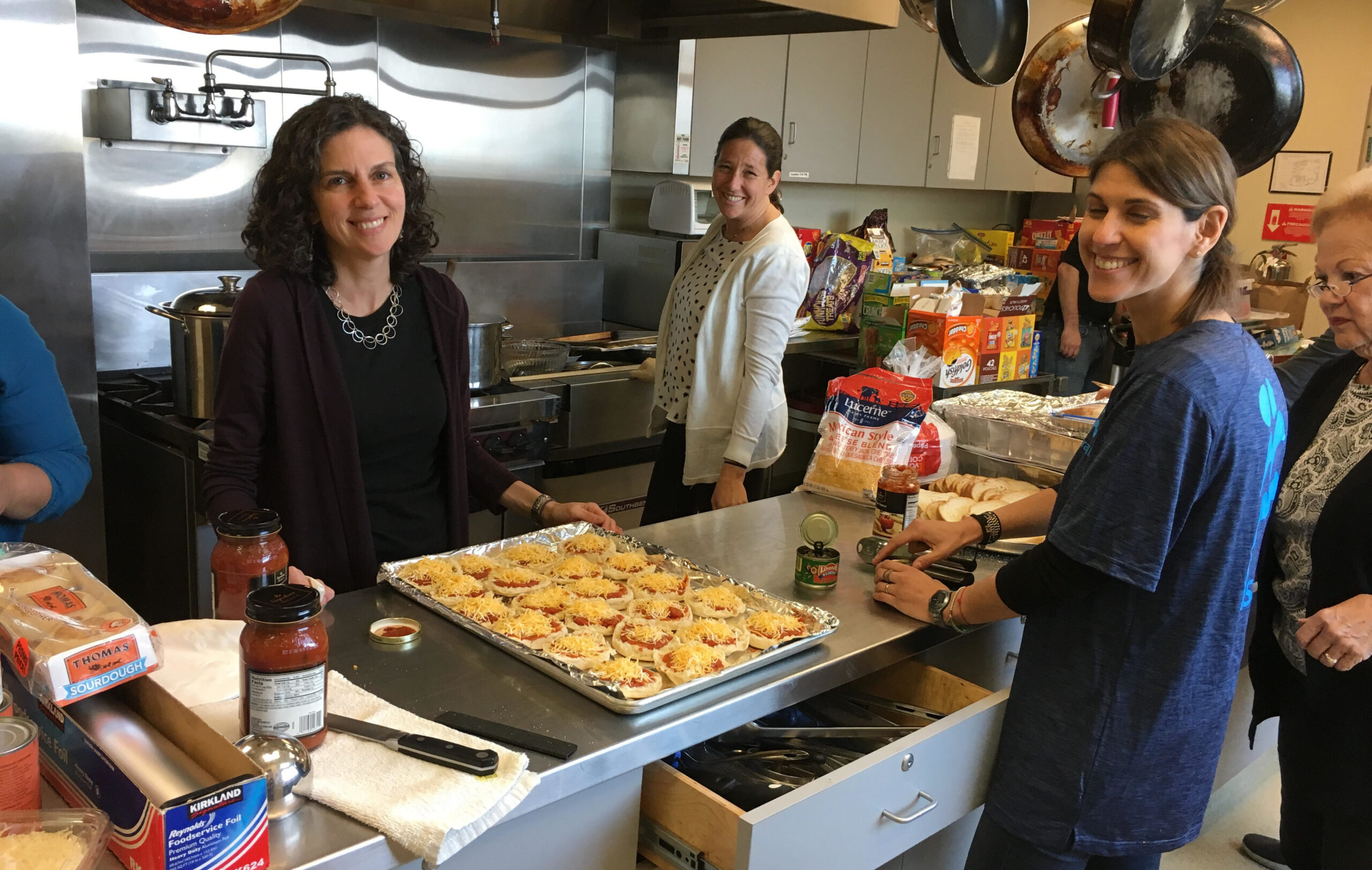 Volunteers from Kol Shofar, led by Rabbi Chai Levy (left) provided lunch to displaced families sheltering at Congregation Shomrei Torah in Santa Rosa, Oct. 11. (Photo/Courtesy IsraAid)