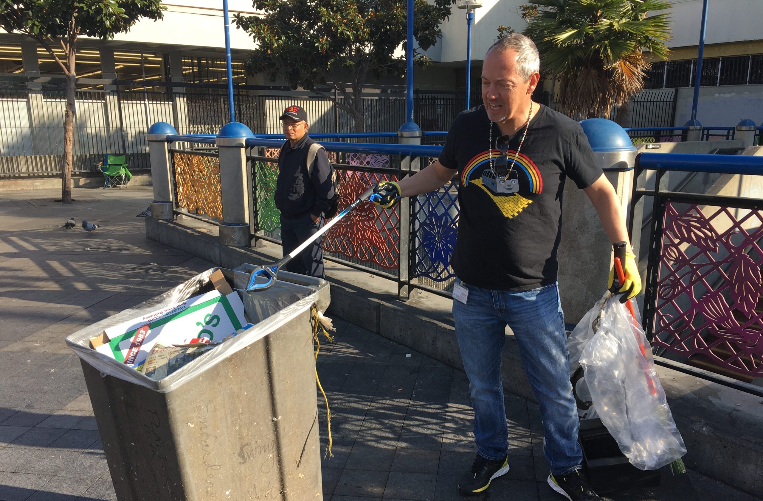 Bevan Dufty cleaning up the 16th Street Mission BART station plaza, Nov. 2017 (Photo/Courtesy Susie Neilson-Mission Local)