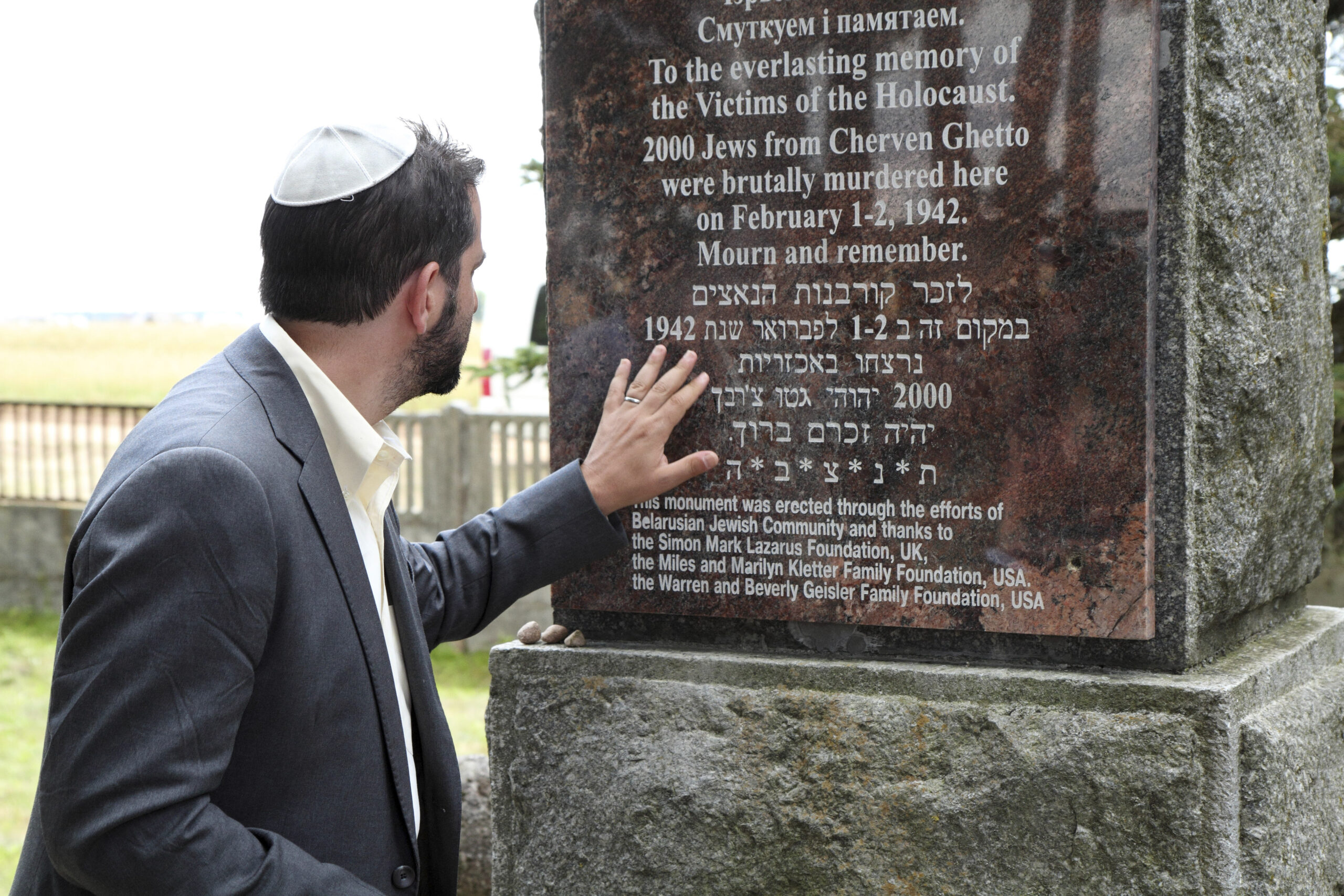 A visitor to the Holocaust memorial erected in Cherven, Belarus (Photo/Courtesy Belarus Holocaust Memorial Project)