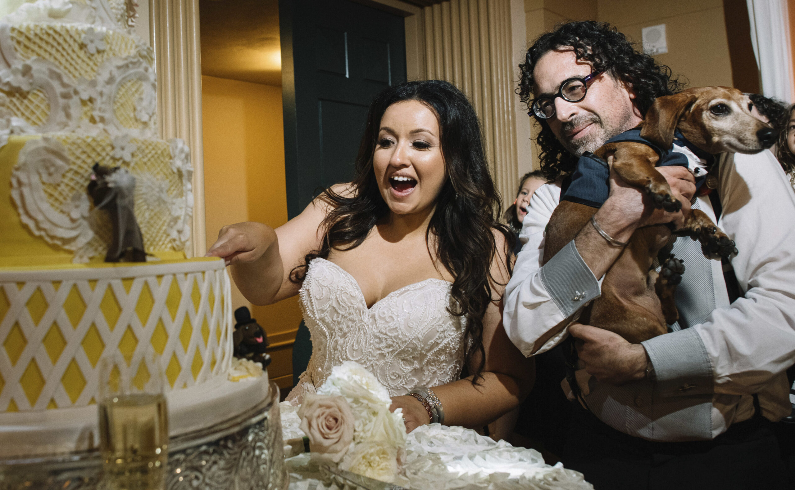 Christina and Robert Soriano celebrate with their dachshund, Wally (Photo/Ari Simphoukham justari.com)