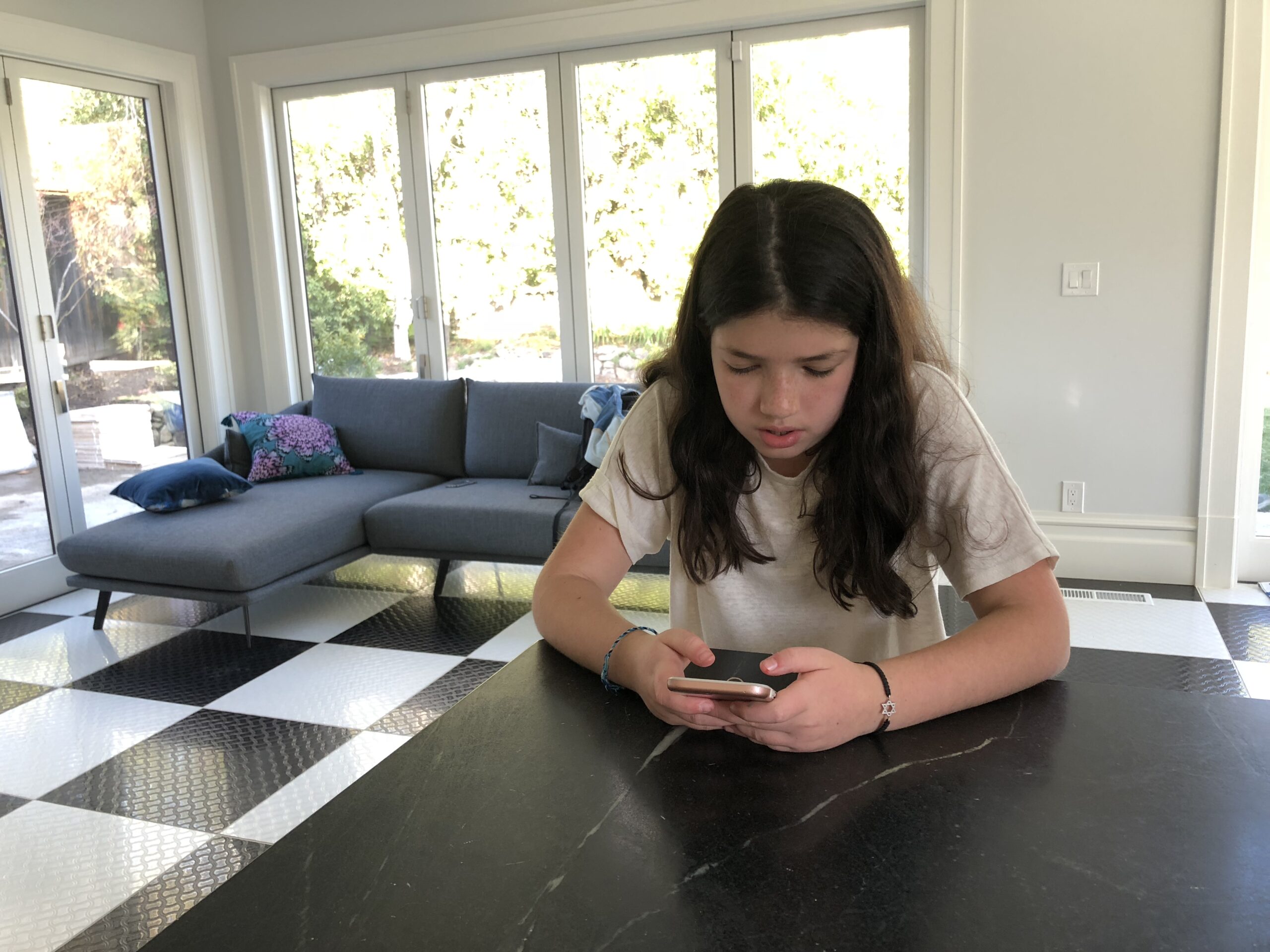 One of the columnists' kids, staring at a screen. (Photo/Nicki Gilbert)