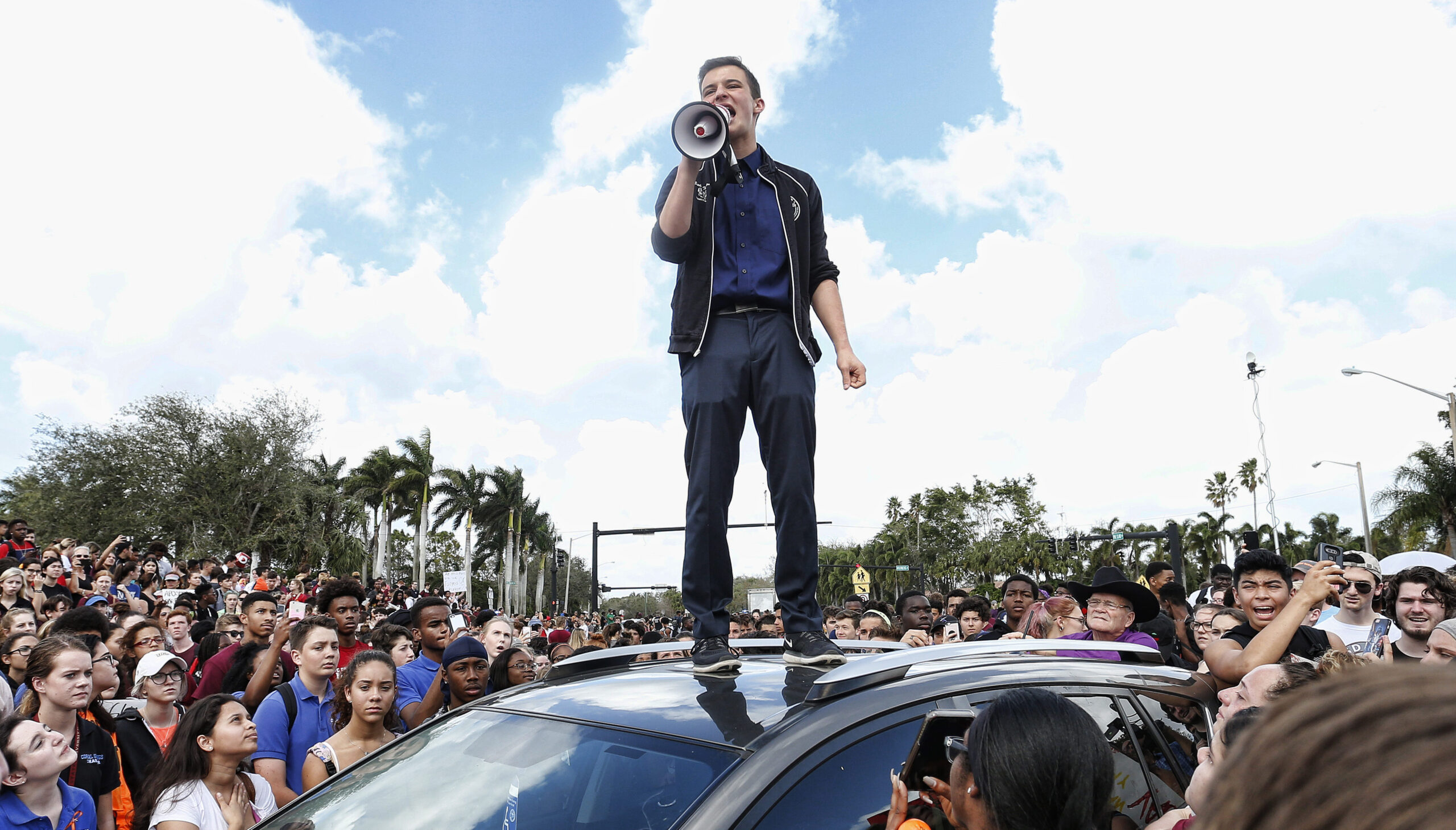 Marjory Stoneman High School student Cameron Kasky addressing area students as they rally at his school after participating in a countywide school walkout in Parkland, Fla., Feb. 21, 2018. (Photo/JTA-Rhona Wise-AFP-Getty Images)