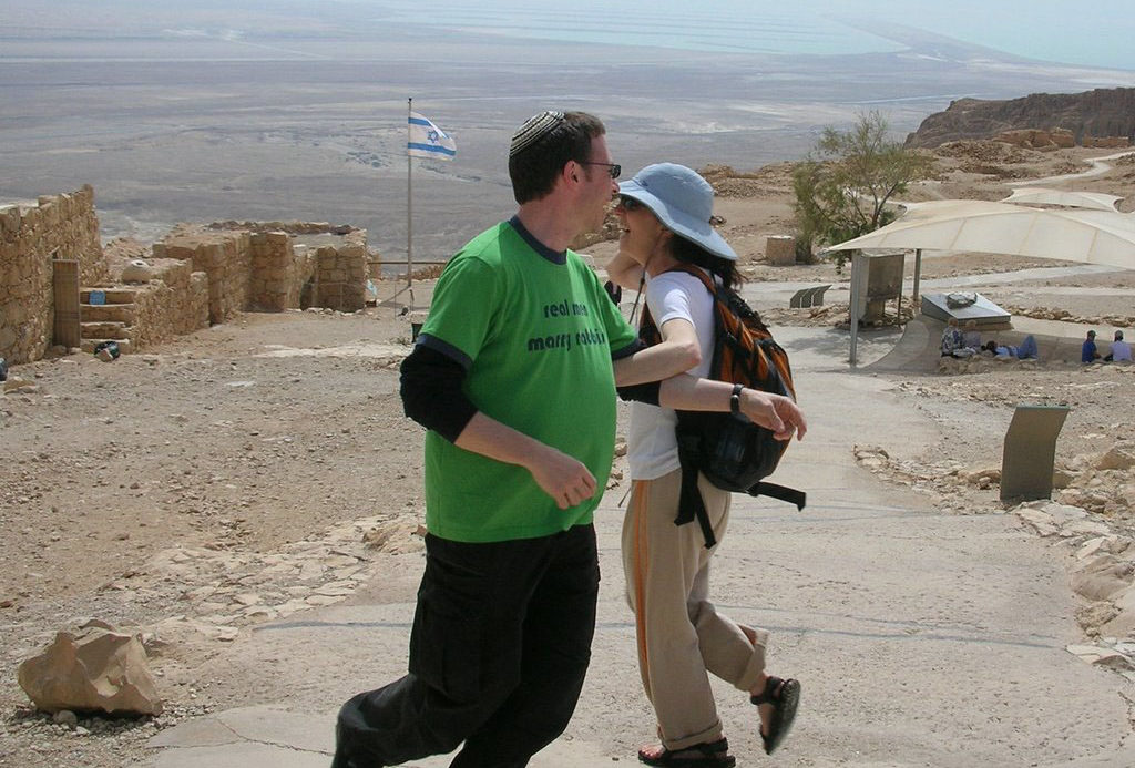 Chai Levy dances with Roger Studley after his marriage proposal on Masada during a 2006 congregational trip.