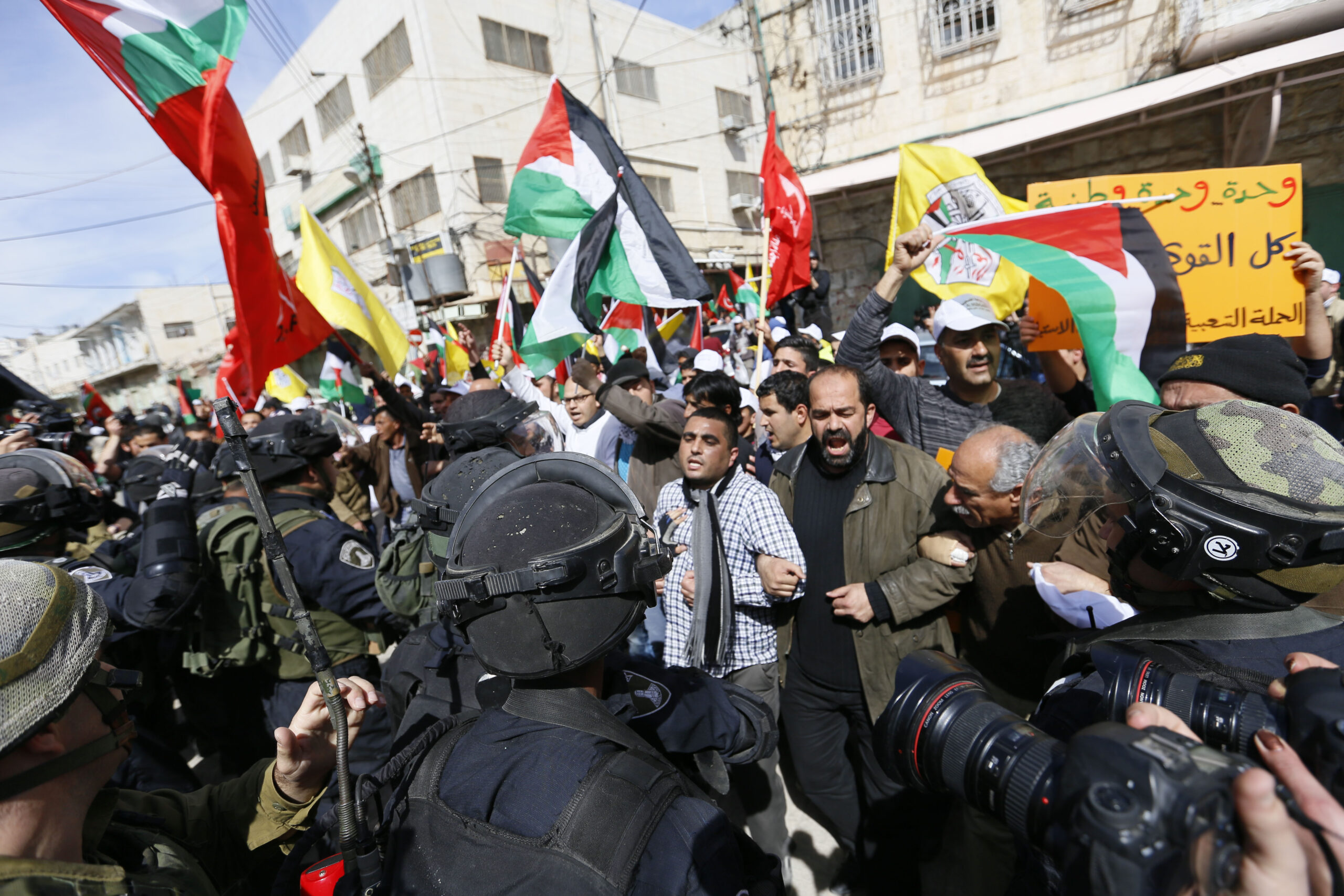 Palestinian protesters met by Israeli border police in Hebron, Feb. 2014 (Photo/Wikimedia-Mustafa Bader CC BY-SA 3.0)