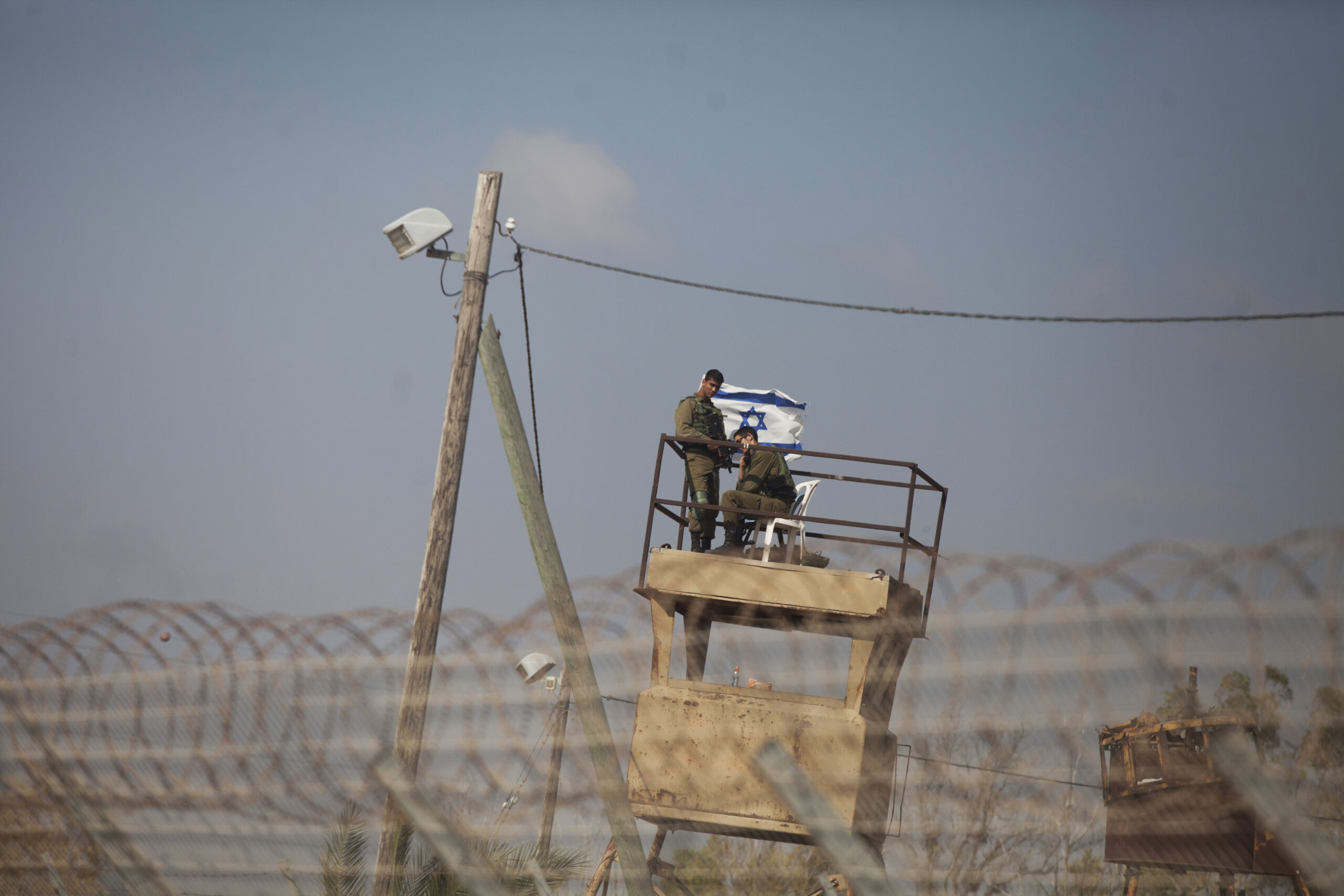 Israeli soldiers standing watch on the fields of Nahal Oz on the Israeli Gaza border, near the Gaza neighborhood of Shajaiya, May 15, 2018 (Photo/JTA-Lior Mizrahi-Getty Images)