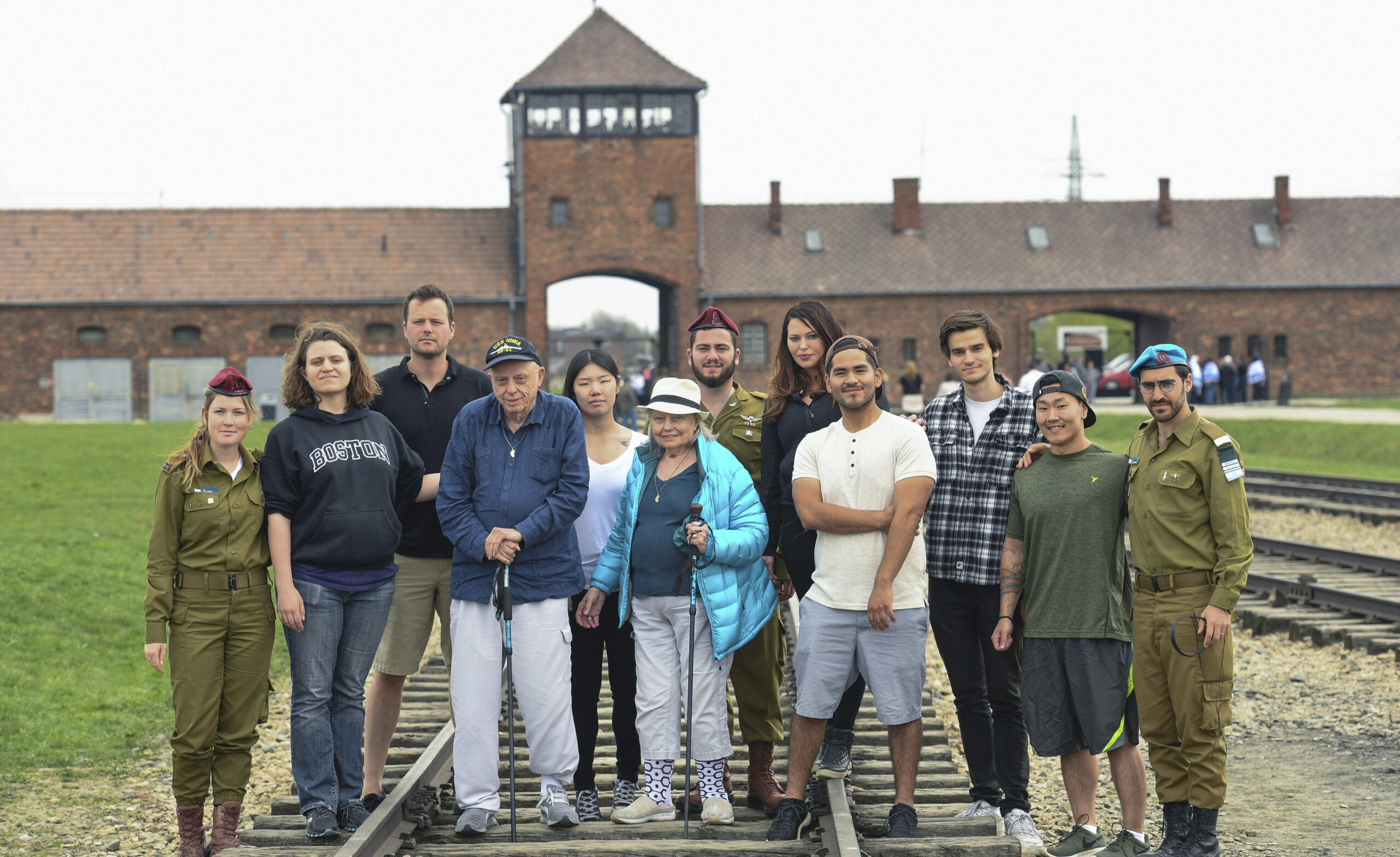 The Calvin family with IDF soldiers on the tracks leading to Auschwitz-Birkenau on April 15 (Photo/Shahar Azran)