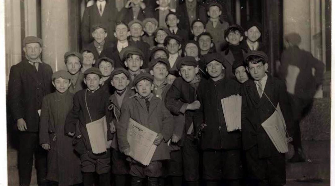 Newsboys for the Forward wait for their copies in the early morning hours, March 1913. (Photo/Wikimedia-Lewis Hine)