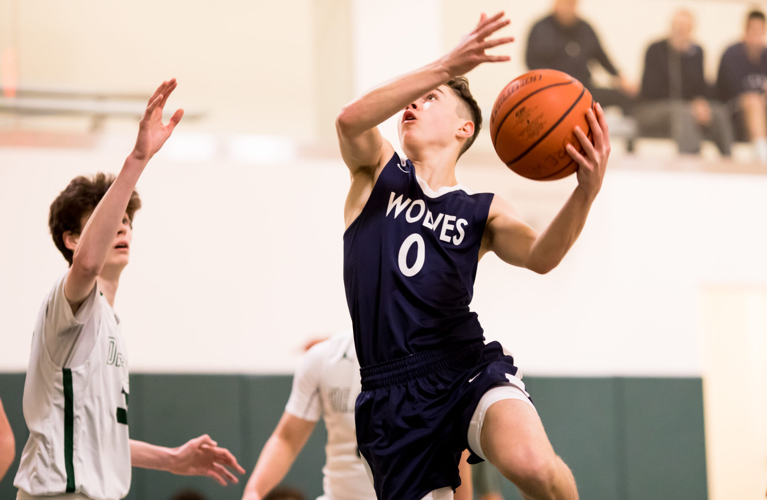 Earlier in the season, Aiden Swan of the JCHS Wolves goes for a layup.