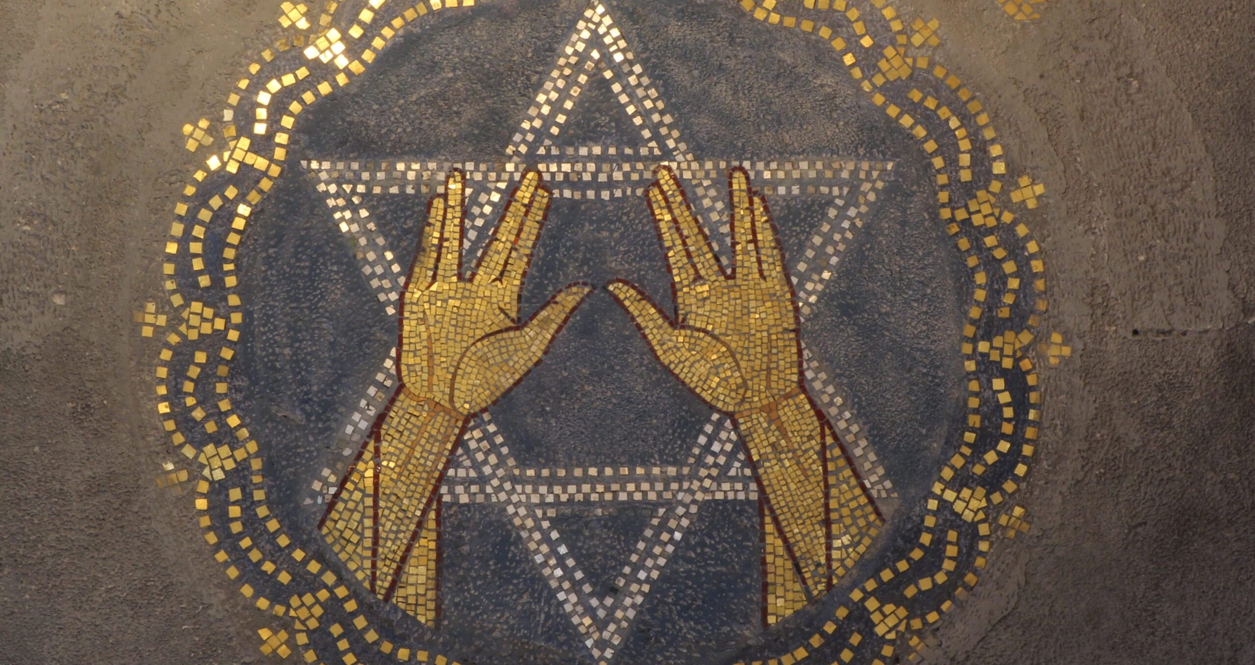 A mosaic in the synagogue of Enschede, Netherlands, shows the hand signal given by priests when they recite the Priestly Blessing, which is described un Naso, this week's Torah portion. (Photo/Wikimedia-Kleuske CC BY-SA 3.0)