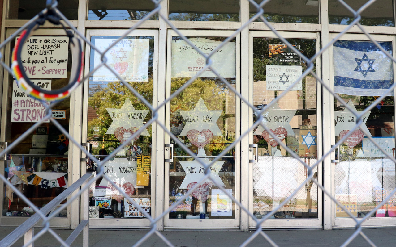 The doors of the Tree of Life synagogue feature memorials surrounding the building nearly a year after the attack there that killed 11 worshippers. (Photo/JTA-Grace Yagel)