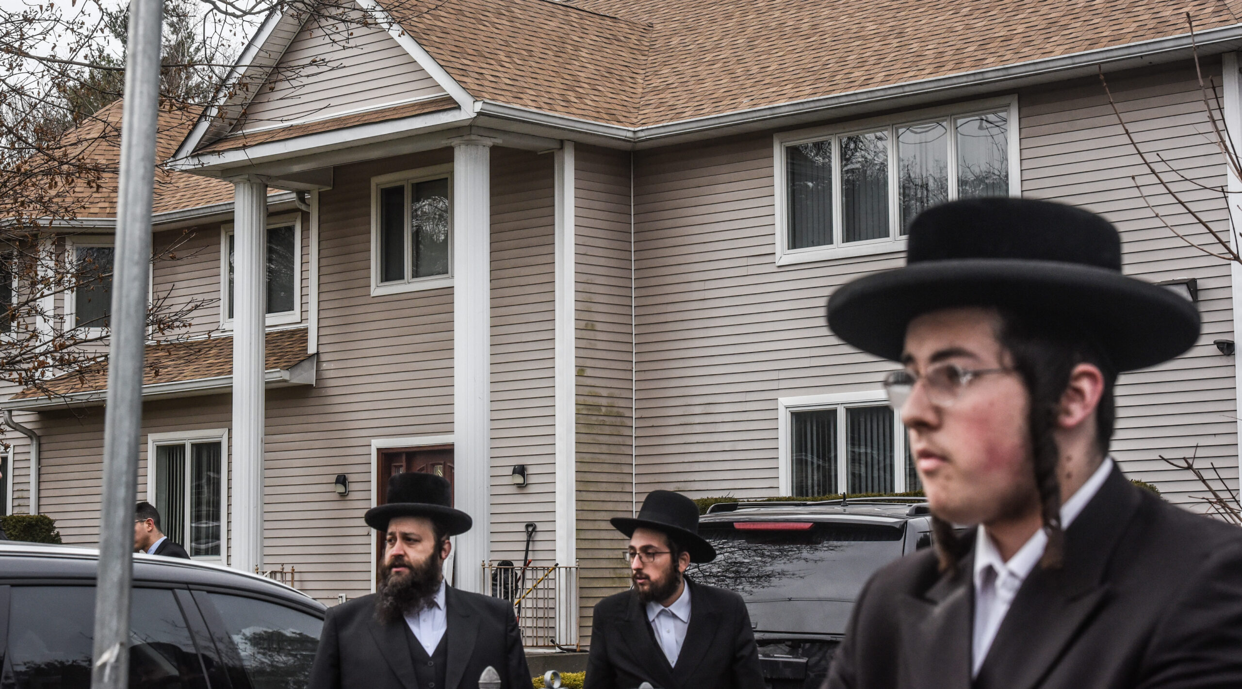 People gather in front of the Monsey house of Rabbi Chaim Rottenberg, the site of an attack at a Hanukkah party by a machete-wielding man, Dec. 29, 2019. (JTA/Stephanie Keith/Getty Images)