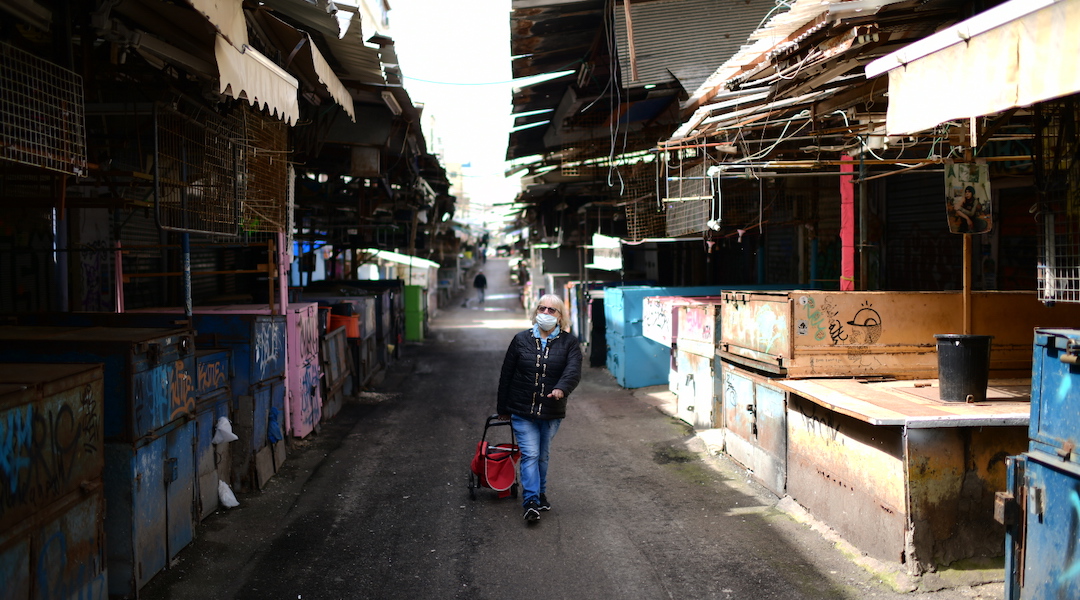 The empty Carmel market in Tel Aviv on March 23, 2020, following the government's orders to keep all bars, restaurants, malls, and markets closed in an effort to contain the spread of the coronavirus. (Photo/JTA-Tomer Neuberg-Flash90)
