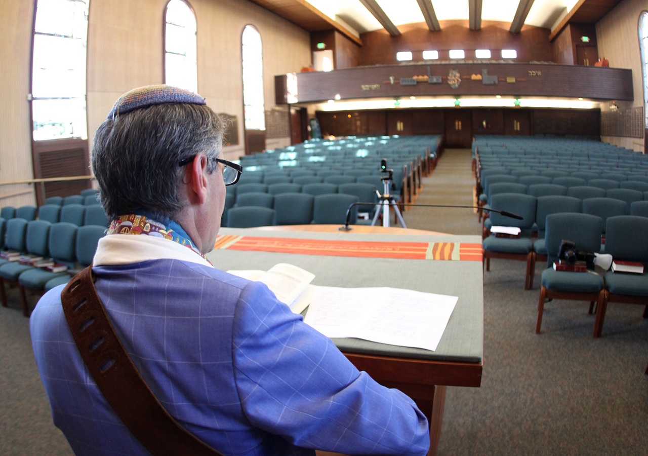 Rabbi Mark Bloom streams a live Shabbat service from Temple Beth Abraham in Oakland, May 2020. (Photo/Michael Fox)