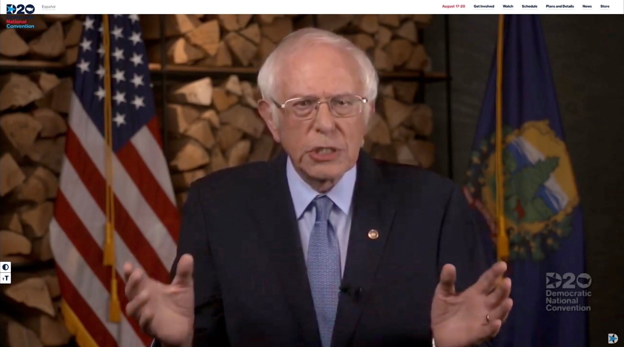 Bernie Sanders speaks with a US flag behind him