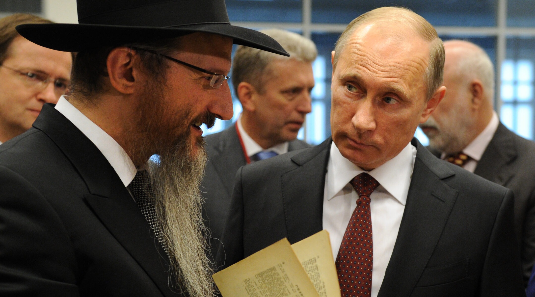 Russia's President Vladimir Putin, right, and Russia's Chief Rabbi Berel Lazar attend a ceremony marking the handover of items in the Schneerson library to a Chabad-run museum in Moscow, June 13, 2013. (Photo/JTA-Yuri Kadobnov-AFP via Getty Images)