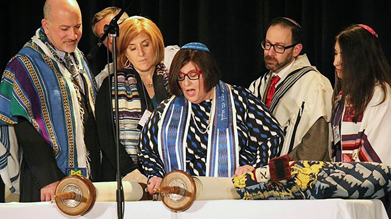 Rabbi Denise Eger (center) reads Torah during her March 16, 2015 installation as president of the Central Conference of American Rabbis. (Photo/JTA-David A.M. Wilensky)