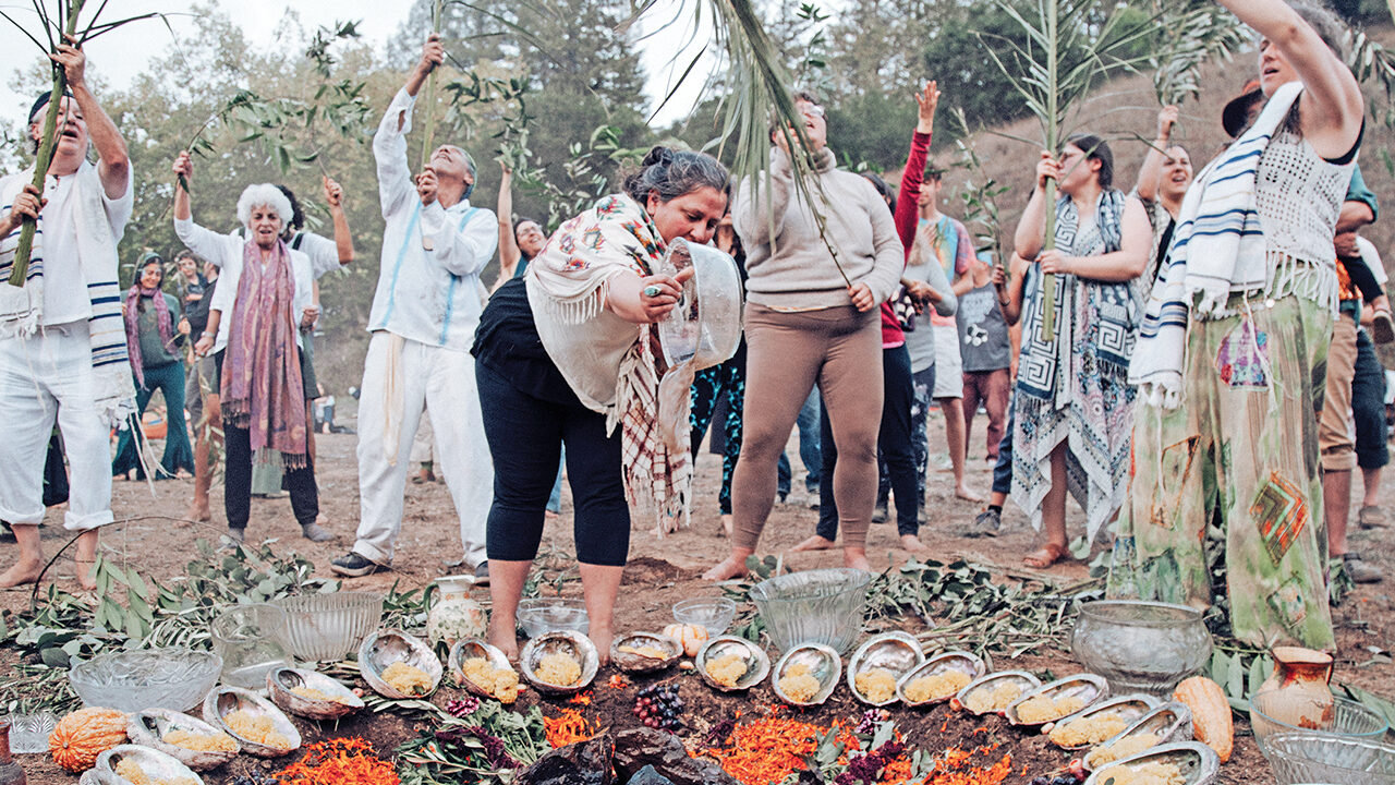 Attendees of a Wilderness Torah gathering for Sukkot perform a version of the ancient Simchat Beit Hashoeivah ritual in 2022. (Julia Maryanska/Courtesy Wilderness Torah)
