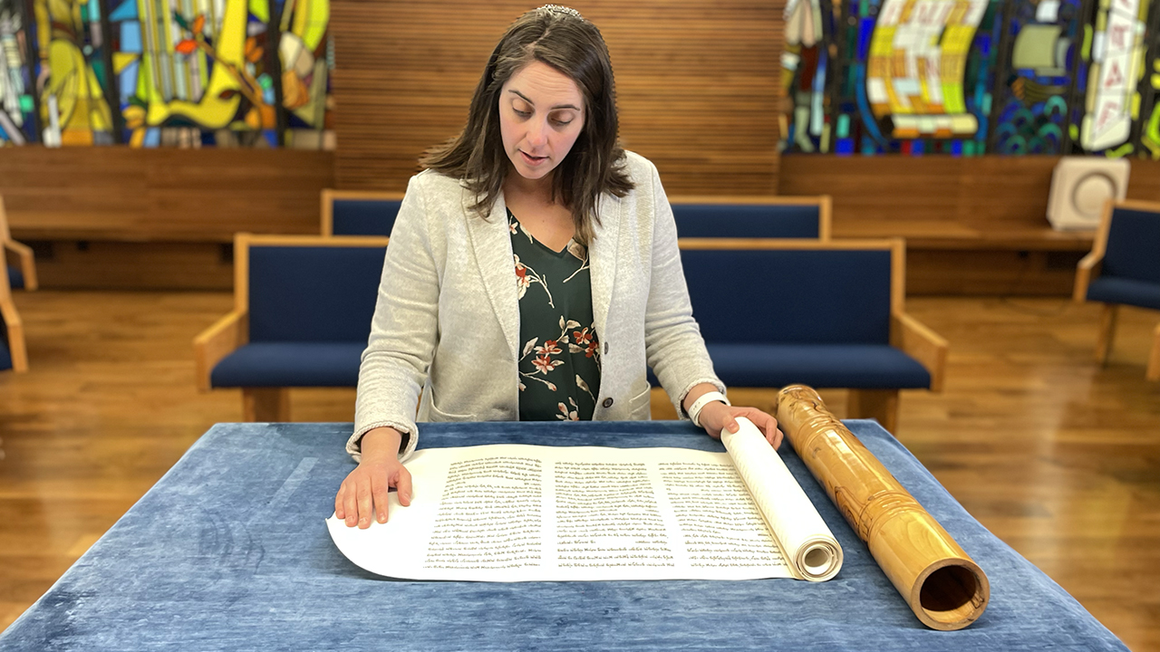 Rabbi Amanda Russell reads from Congregation Beth Sholom's newly commissioned Megillah. (Photo/Courtesy Beth Sholom)
