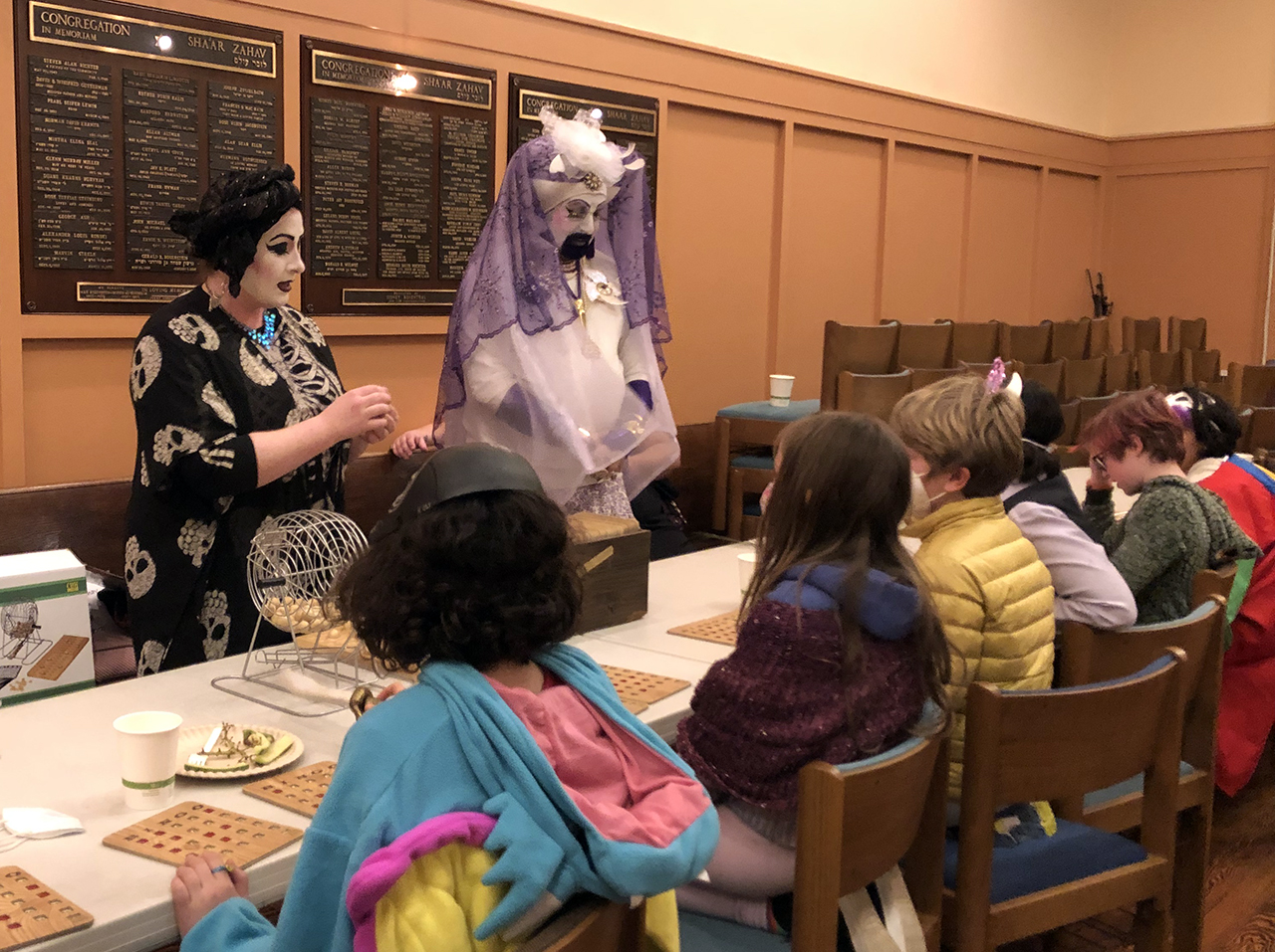 Shalita Corndog and Mina J’Moi lead drag bingo on Purim at Congregation Sha'ar Zahav. (Photo/Courtesy Rabbi Mychal Copeland)