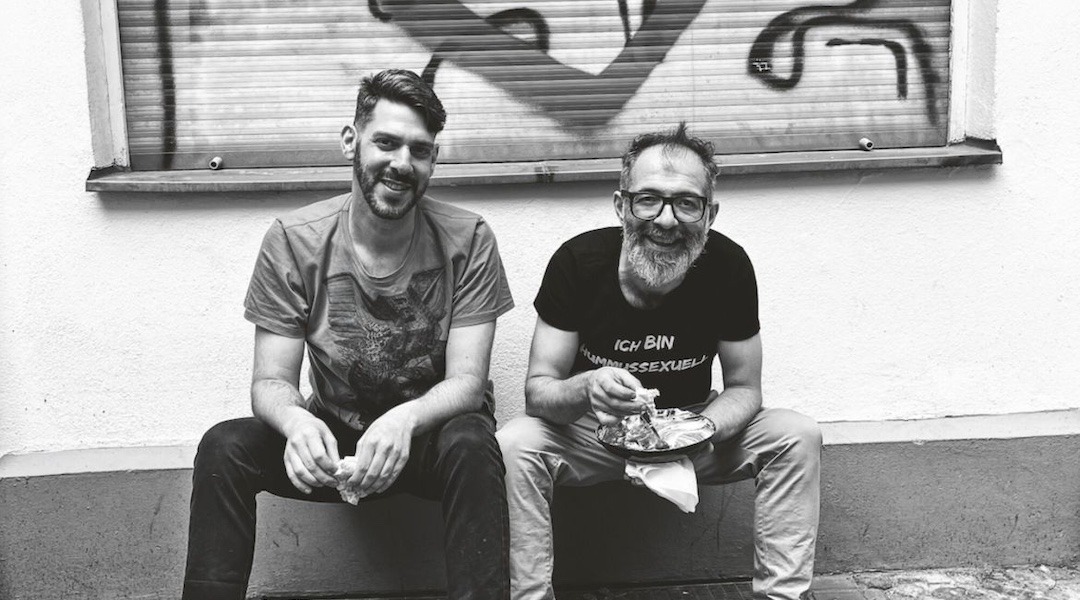 Oz Ben David (right) wears a shirt that translates to "I am a hummussexual." He and Jalil Dabrit opened Kanaan in 2015. (Photo/JTA-Elisabeth Patrikiou)