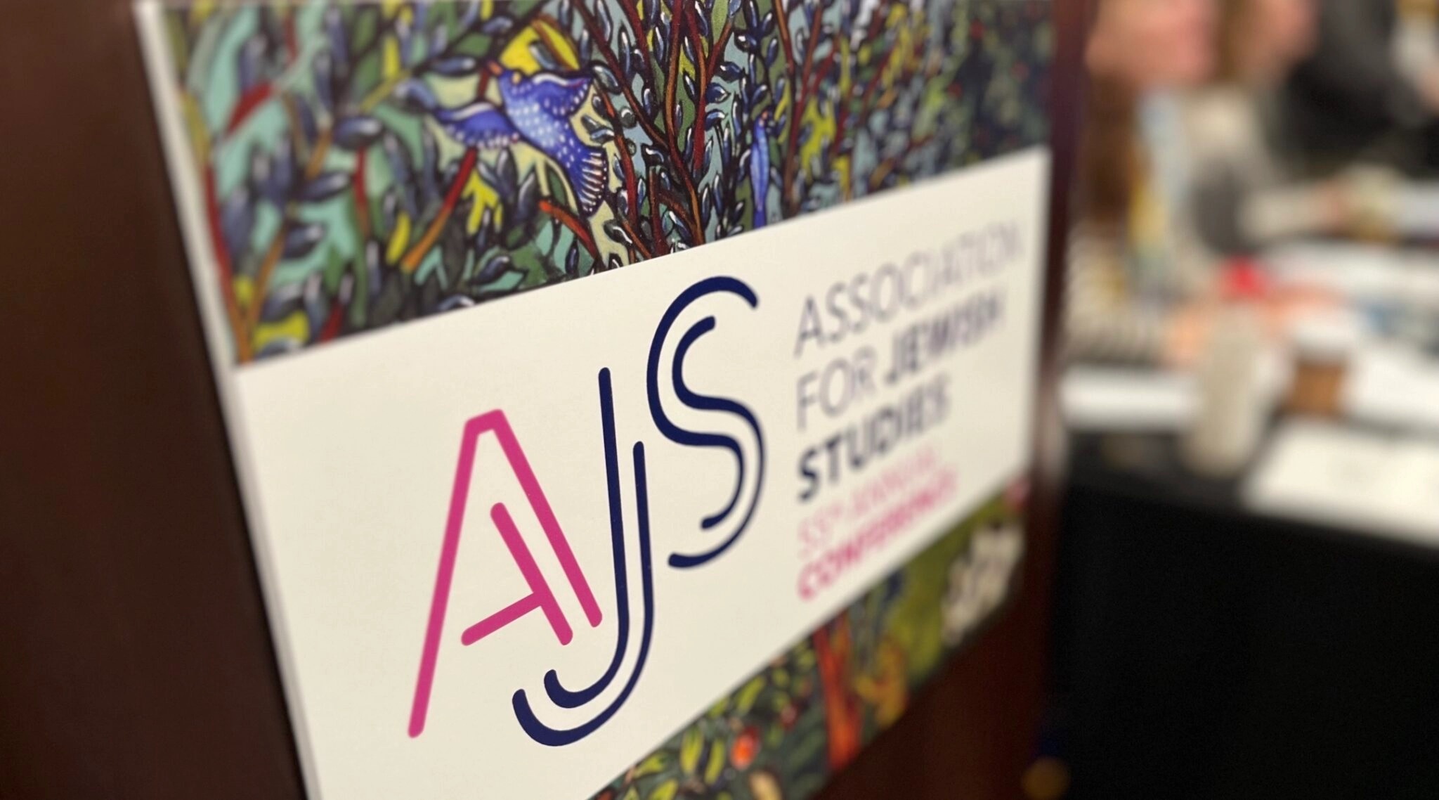 Placard states AJS and Association for Jewish Studies