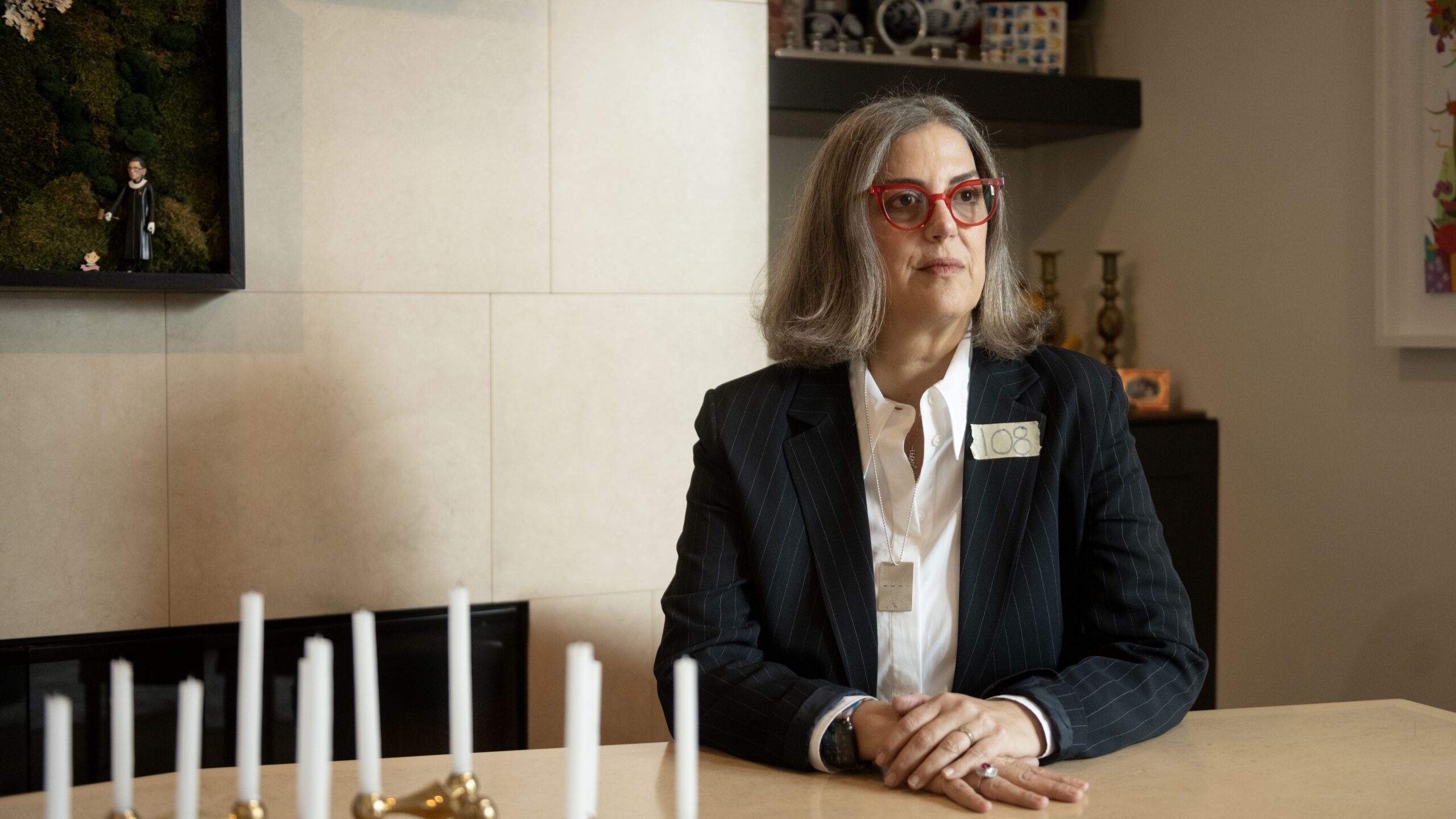 Woman sits at table