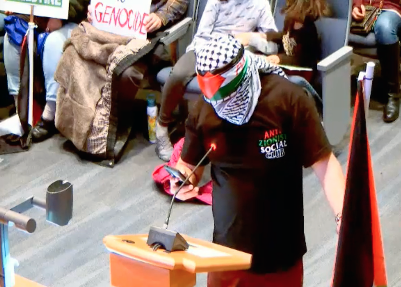 A supporter of a measure requiring Hayward to divest from four companies that do business with Israel speaks at a Hayward City Council meeting on Jan. 23, 2024. (Screenshot)