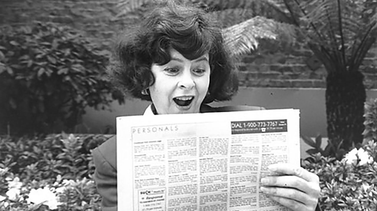 The author checking the personal ads in the Jewish Bulletin in 1995. (Photo/Cathleen Maclearie)