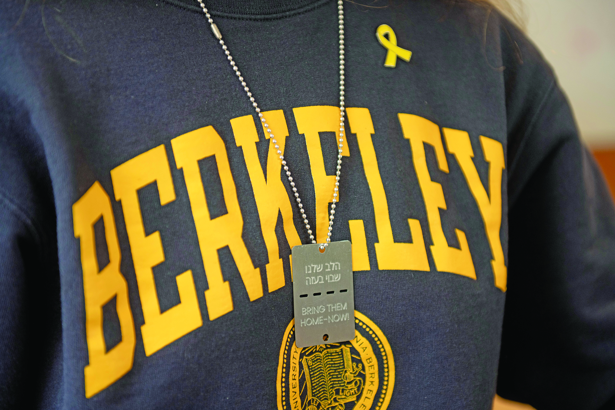 "Rachel" wears a “Bring Them Home – Now!” dog tag in support of the hostages taken by Hamas. (Photo/Aaron Levy-Wolins)
