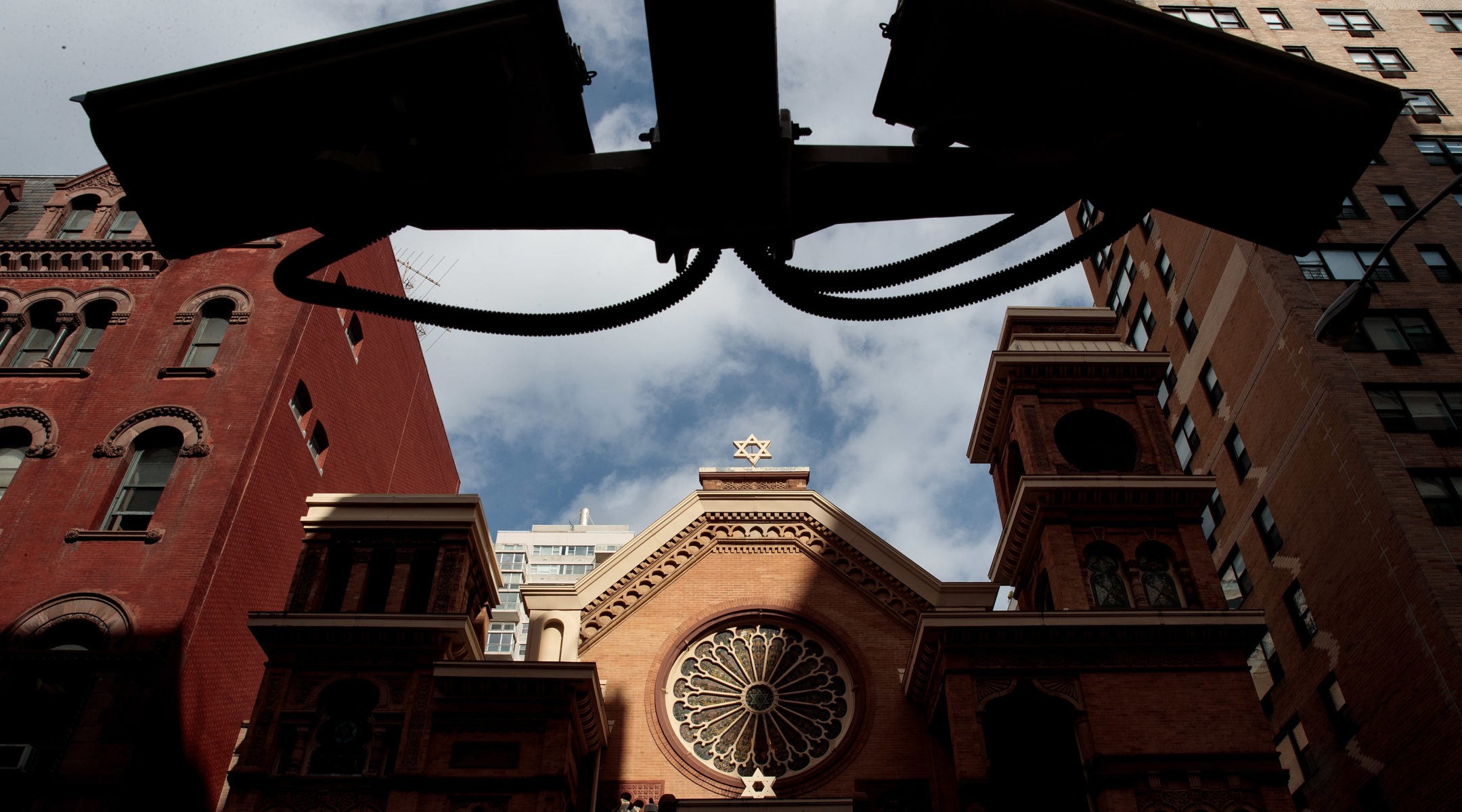 Security cameras hang across the street from the Park East Synagogue in New York City. (Photo/JTA-Drew Angerer-Getty Images)