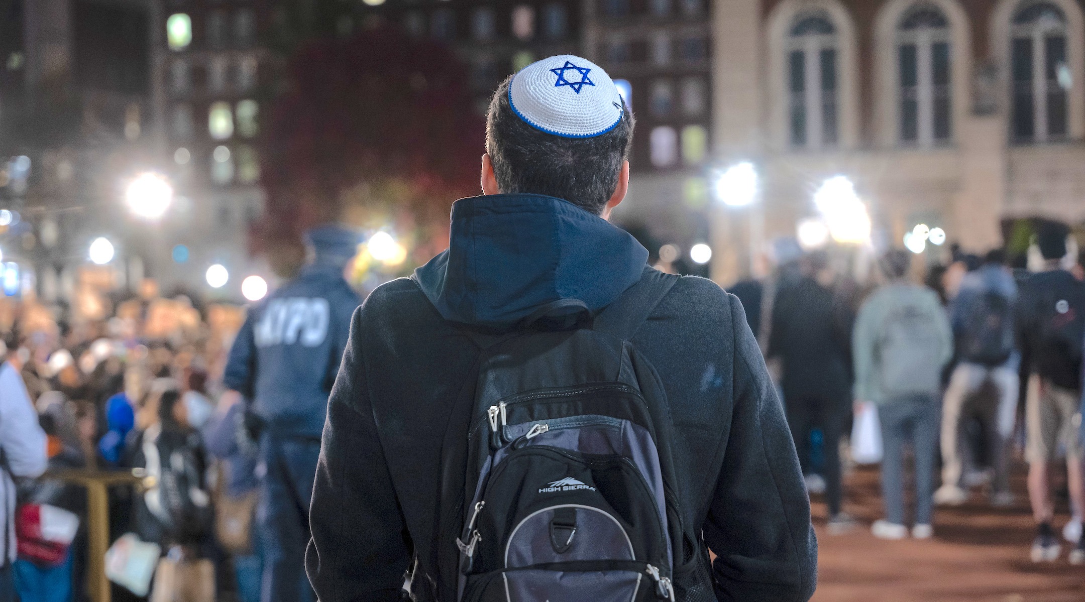 A Jewish student watches a protest in support of Palestinians and for free speech at New York’s Columbia University campus, Nov. 14, 2023. (Photo/JTA-Spencer Platt-Getty Images)