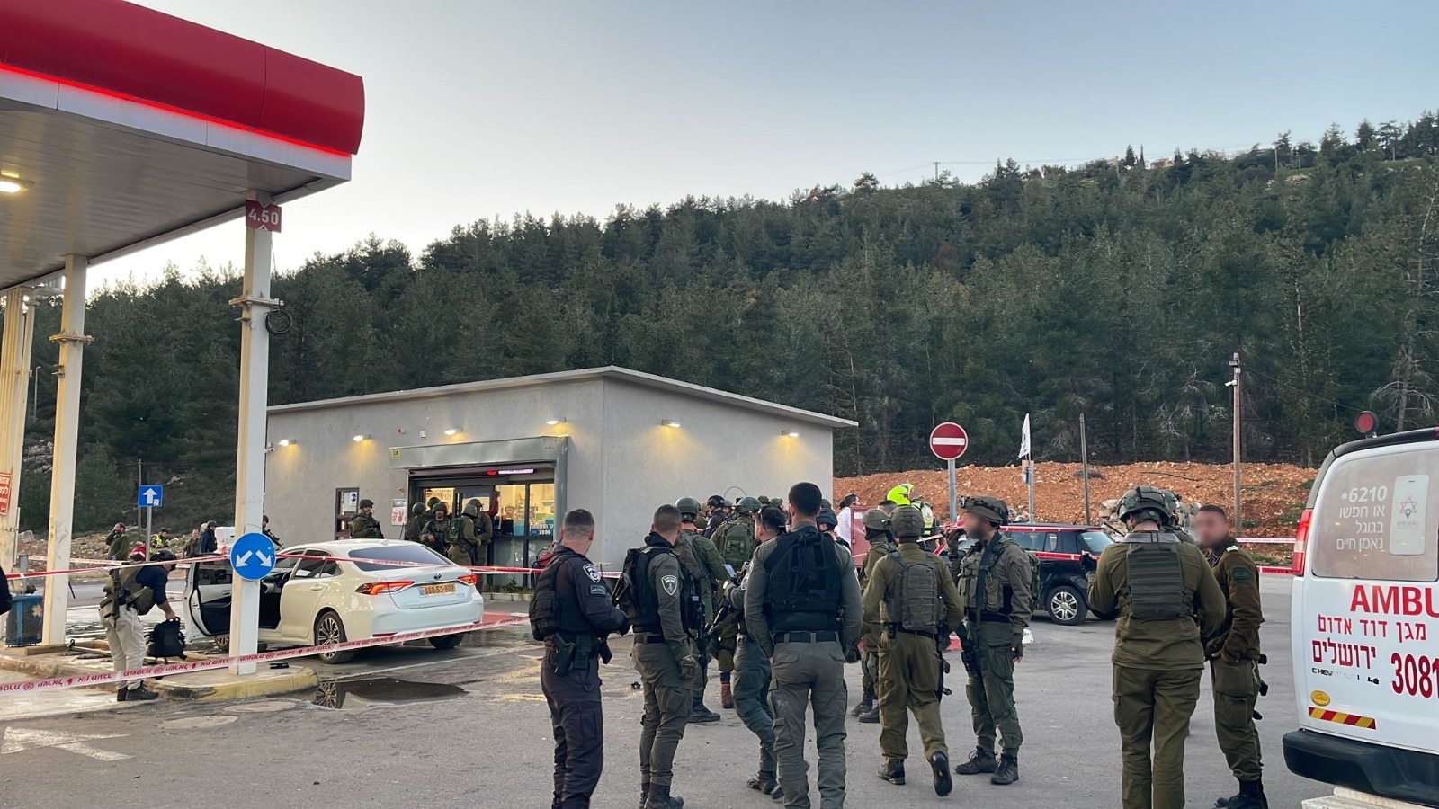 Israeli army troops consult after a terrorist attack at a gas station adjacent to the West Bank settlement of Eli, Feb. 29, 2024. (Photo/JTA via IDF)