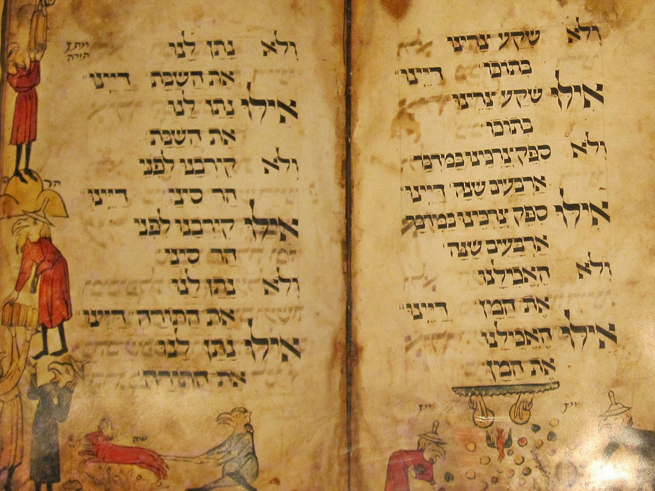 These pages from the Birds' Head Haggadah (Southern Germany, ca. 1300) show part of the lyrics of Dayeinu. (Photo/Wikimedia user Sodabottle CC BY-SA 3.0)
