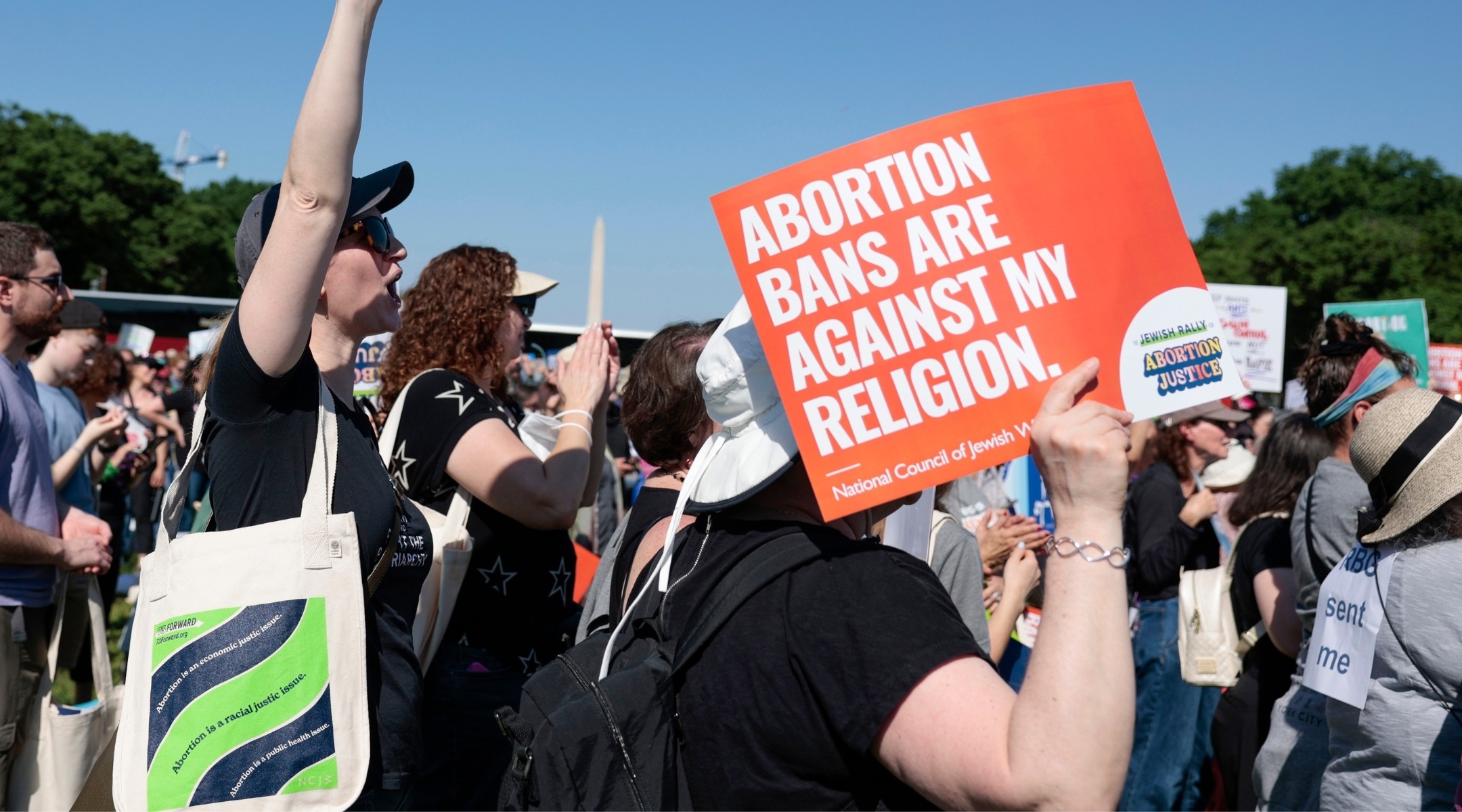 A protester holds a sign saying "Abortion bans are against my religion" at the May 2022 Jewish Rally For Abortion Justice in Washington, D.C. (Photo/JTA-Anna Moneymaker via Getty)