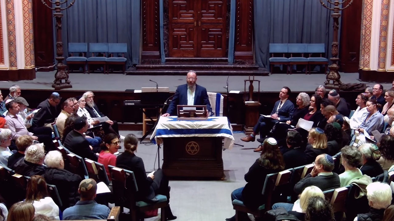 Rabbi Jeremy Kalmanofsky speaks during an Israel-solidarity service in November 2023. Kalmanofsky is among a number of American rabbis to say that Israel's war is presenting challenging questions six months in. (Screenshot)