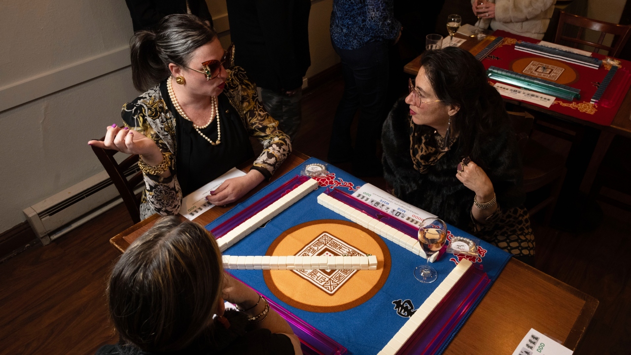 Kara Yugoff (left) chats with Nila Rosen during a mob wife–themed mahjong pop-up at an Italian restaurant in San Francisco, March 13, 2024. (Photo/Aaron Levy-Wolins)
