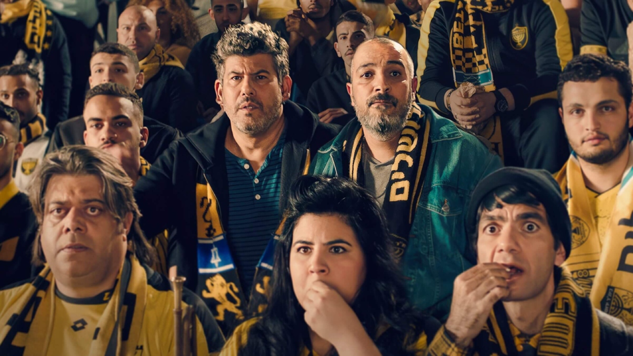 Beitar fans watching a match in “Bros,” now streaming on Netflix. (Photo/Netflix)