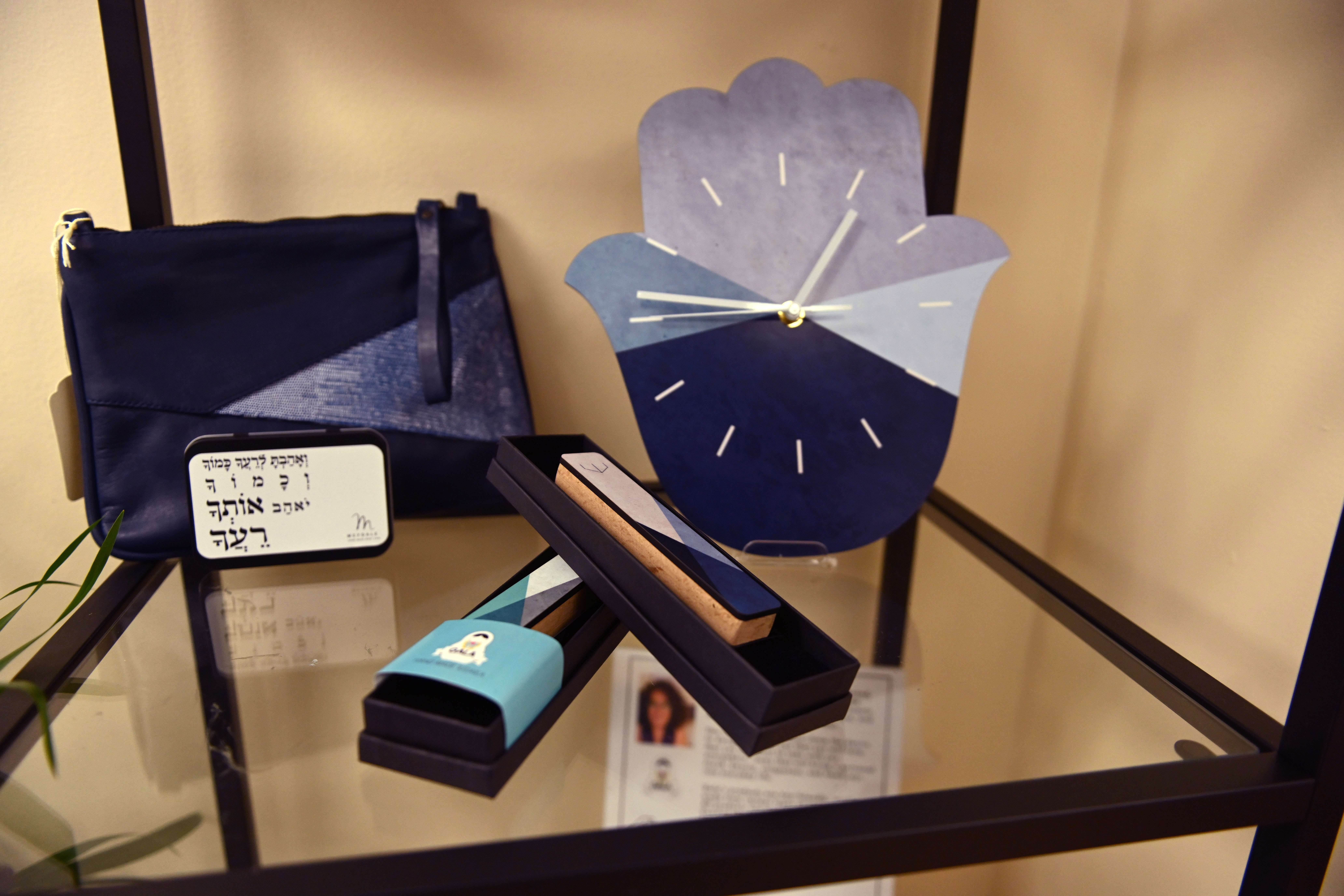 Items for sale at Ankor include a hamsa clock and mezzuzot handcrafted by Israeli artists. (Photo/Aaron Levy-Wolins)